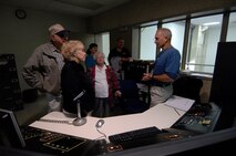 MINOT AIR FORCE BASE, N.D. -- Glynn Breuer, Rockwell Collins contractor, explains the B-52 simulator control consul to attendees of the retiree appreciation day Oct. 2 here. The 5th Bomb Wing and 91st Missile Wing sponsored the 2009 Military Retiree Appreciation Day to say thank you to the area’s retirees and their families for their service and sacrifice made throughout their military career. The event enabled numerous base agencies to present updates and issues of importance to retirees through an informational fair and afternoon of briefings. (U.S. Air Force photo by Senior Airman Matthew Smith)