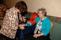 MINOT AIR FORCE BASE, N.D. -- Pat Miller from the Family Practice Clinic, checks the blood pressure of Diane Mittelstedt, a Bismarck, N.D. native, during the retiree appreciation day Oct. 2 here. The 5th Bomb Wing and 91st Missile Wing sponsored the 2009 Military Retiree Appreciation Day to say thank you to the area’s retirees and their families for their service and sacrifice made throughout their military career. The event enabled numerous base agencies to present updates and issues of importance to retirees through an informational fair and afternoon of briefings. (U.S. Air Force photo by Senior Airman Matthew Smith)