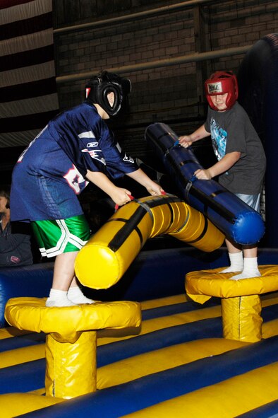 HANSCOM AIR FORCE BASE, Mass. – Hanscom celebrated Oktoberfest Oct. 2 at the Aero Club hangar. Shown here, children enjoy one of the many activities that were featured during the event that also included live entertainment, food and fun for the entire Hanscom community. Oktoberfest is one of many events Hanscom has lined up to help celebrate the Year of the Air Force Family that runs until July 2010. (Air Force photo by Linda LaBonte Britt) 