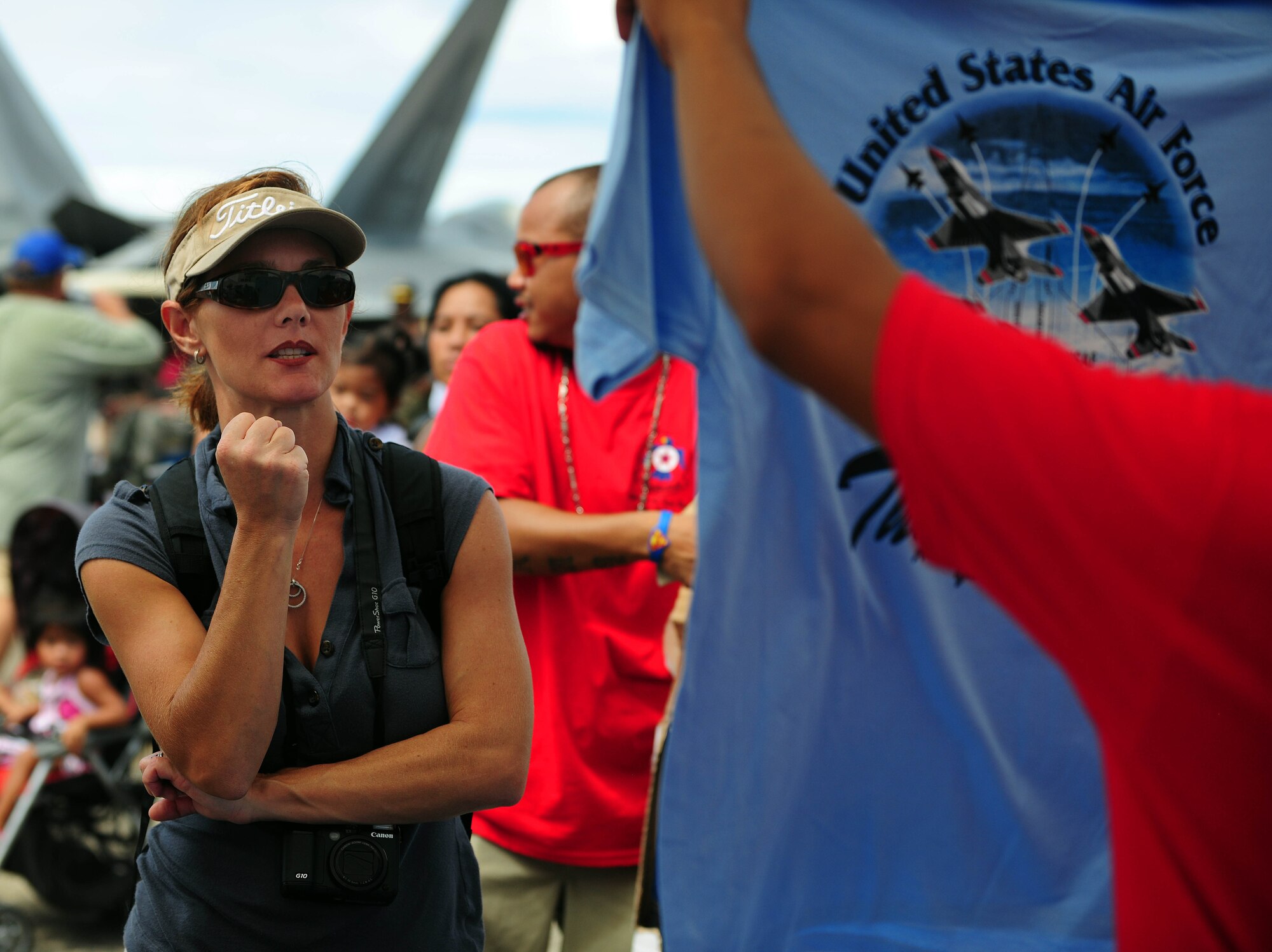 ANDERSEN AIR FORCE BASE, Guam - Kim Brush, a Colorado native, pumps her fist when she finds the T-shirt that she wants from a vendor during Team Andersen Air Show '09 "Air Power Over the Marianas" here Oct. 7. The U.S. Air Force Thunderbirds is the premier aerial demonstration team representing Airmen worldwide. Andersen AFB rescheduled its air show for after cancelling it due to Typhoon Melor.  The air show was held primarily to thank the residents of Guam for their continued support to Andersen AFB and the rest of the U.S. Air Force. (U.S. Air Force photo by Airman 1st Class Courtney Witt)
