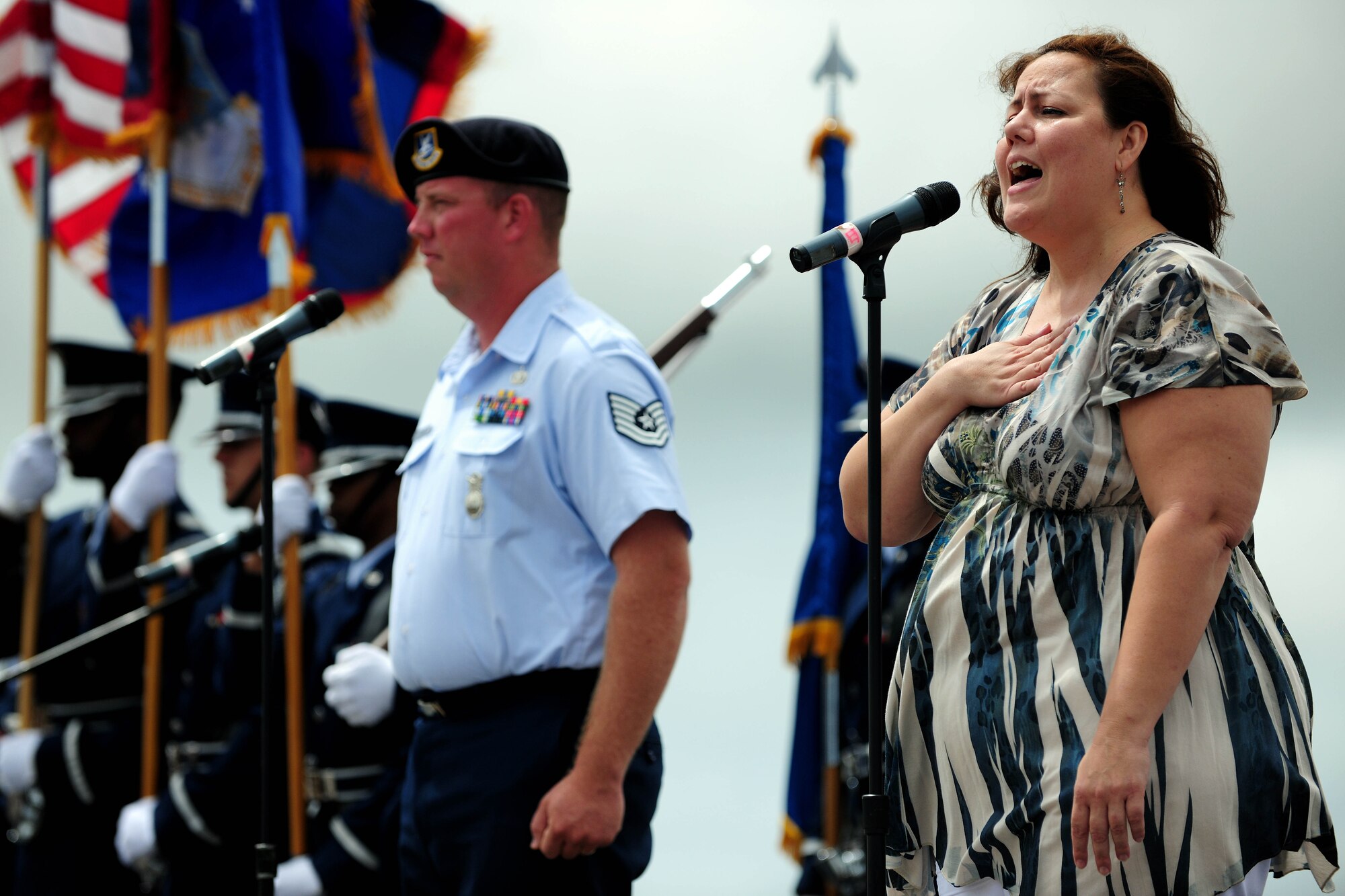 ANDERSEN AIR FORCE BASE, Guam - Margie Richards performs the Guam National hymn here to help kick off Team Andersen Air Show '09 "Air Power Over the Marianas" Oct. 7. The U.S. Air Force Thunderbirds is the premier aerial demonstration team representing Airmen worldwide. Andersen AFB rescheduled its air show for after cancelling it due to Typhoon Melor.  The air show was held primarily to thank the residents of Guam for their continued support to Andersen AFB and the rest of the U.S. Air Force. (U.S. Air Force photo by Airman 1st Class Courtney Witt)
