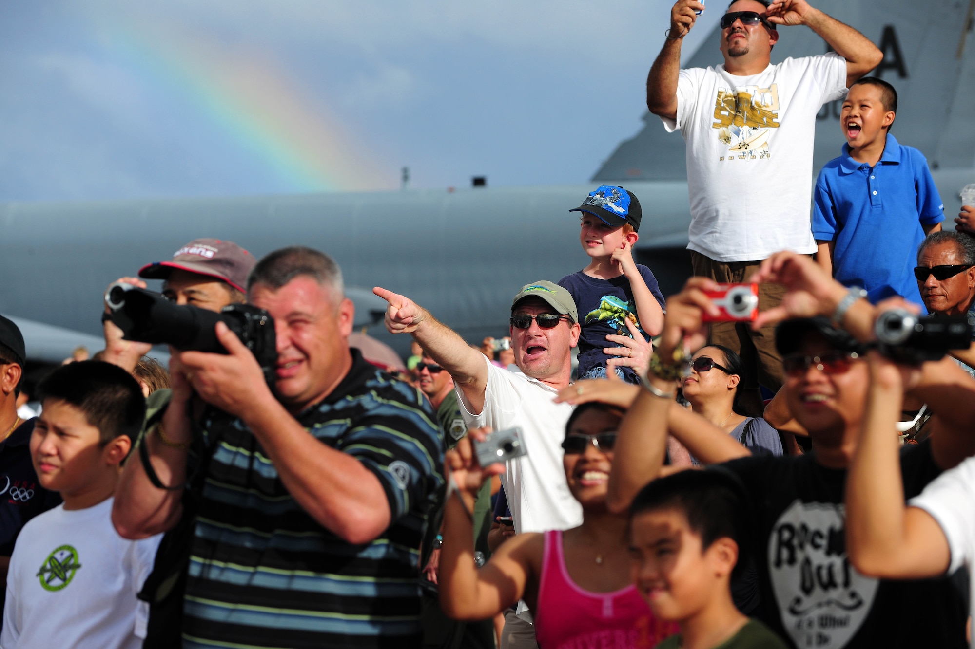 ANDERSEN AIR FORCE BASE, Guam - Fans cheer on the Thunderbirds as they perform aerial maneuvers over Andersen AFB Oct. 7 during Team Andersen Air Show '09 "Air Power Over the Marianas".  The U.S. Air Force Thunderbirds is the premier aerial demonstration team representing Airmen worldwide. Andersen AFB rescheduled its air show for after cancelling it due to Typhoon Melor.  The air show was held primarily to thank the residents of Guam for their continued support to Andersen AFB and the rest of the U.S. Air Force. (U.S. Air Force photo by Airman 1st Class Courtney Witt)
