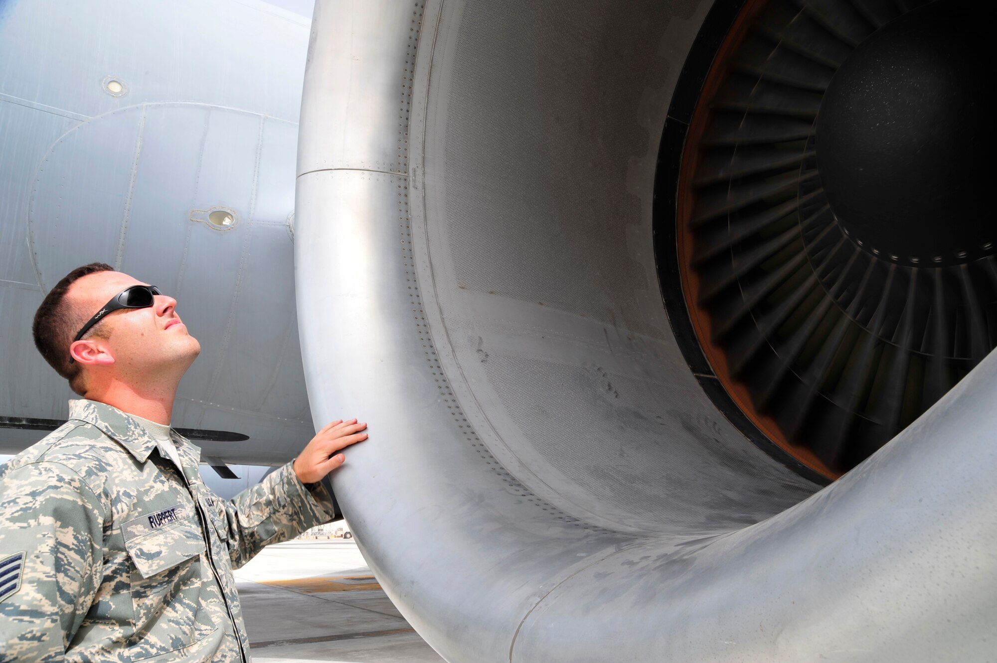 SOUTHWEST ASIA -Staff Sgt. Michael Ruppert, 380th Expeditionary Maintenance Group, inspects the rivets around a KC-10 Extender engine inlet during a follow-up inspection here Oct. 6, 2009. Sergeant Ruppert evaluated a dropped object prevention (DOP) inspection, completed earlier by an aircraft maintenance technician. Sergeant Ruppert is deployed from McGuire Air Force Base, N.J., and grew up in Ft. Myers, Fla. (U.S. Air Force photo/Tech. Sgt. Charles Larkin Sr)