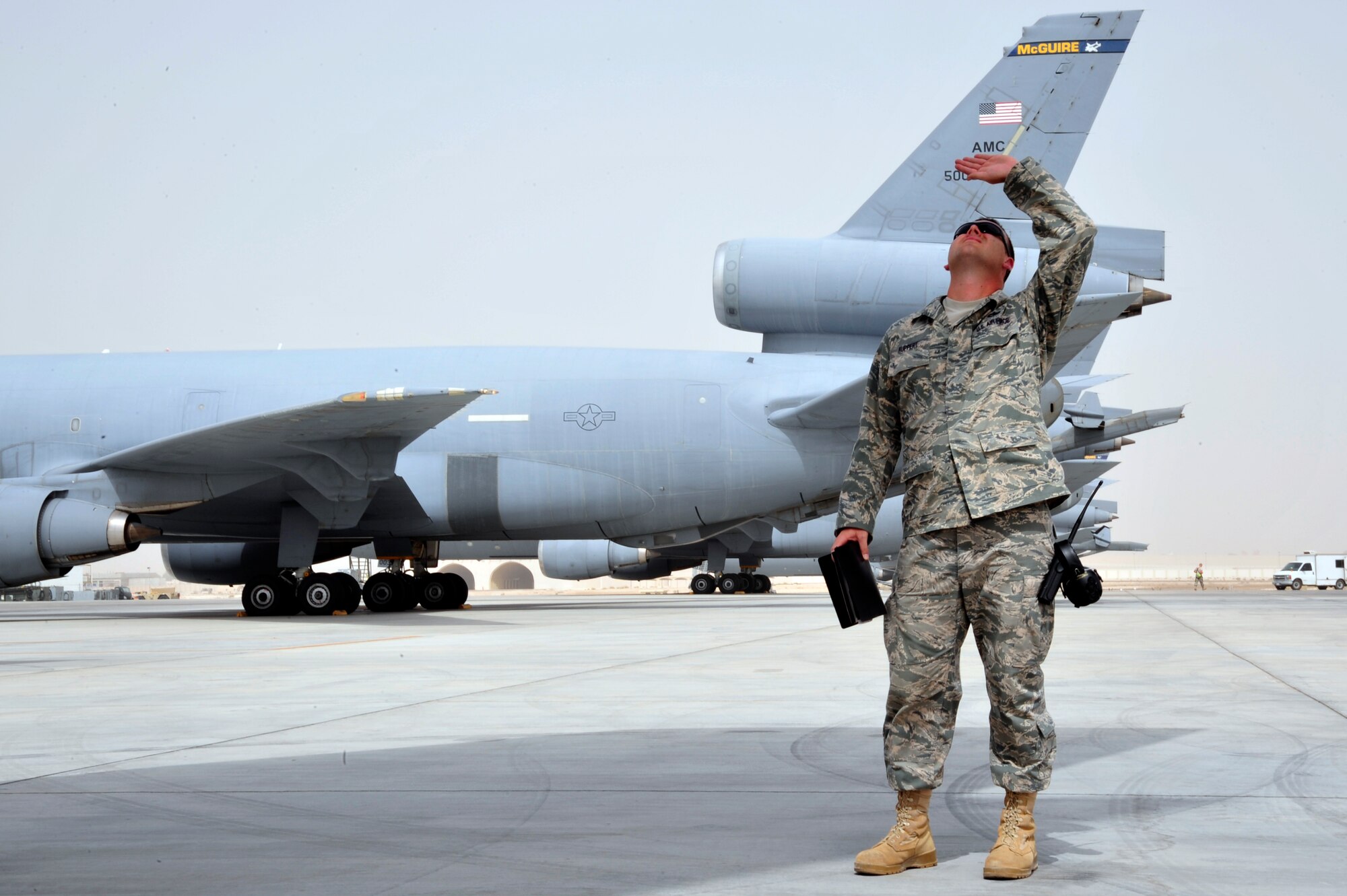 SOUTHWEST ASIA -Staff Sgt. Michael Ruppert, 380th Expeditionary Maintenance Group, quality assurance inspector shields his eyes from the sun during a follow-up dropped object prevention (DOP) inspection, here Oct. 6, 2009. Sergeant Ruppert is deployed from McGuire Air Force Base, N.J., and grew up in Ft. Myers, Fla. (U.S. Air Force photo/Tech. Sgt. Charles Larkin Sr)