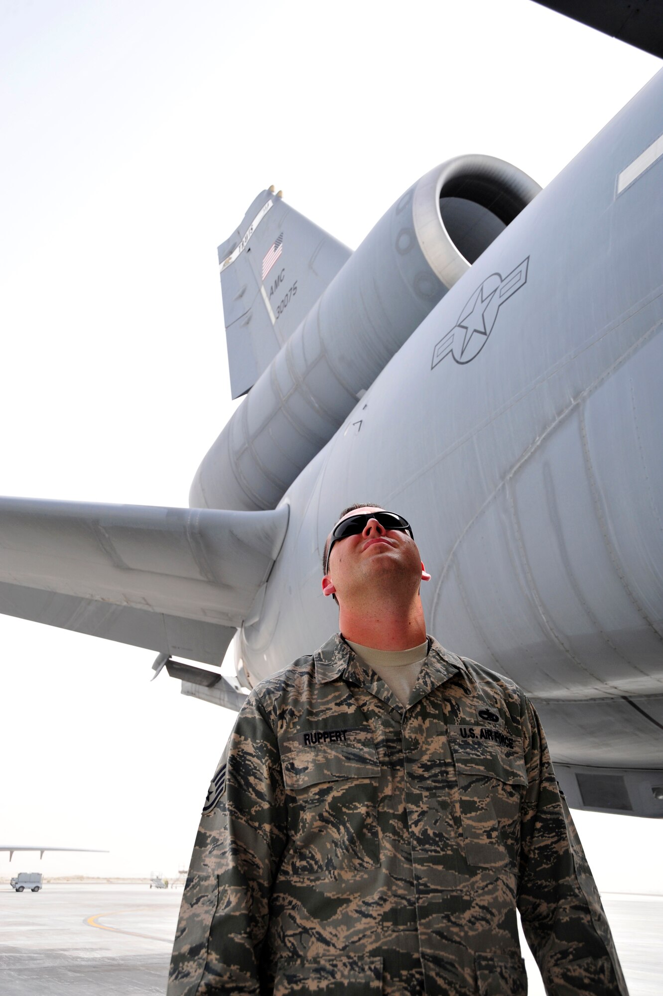 SOUTHWEST ASIA -Staff Sgt. Michael Ruppert, 380th Expeditionary Maintenance Group, scans the flight control surfaces during a follow-up inspection here Oct. 6, 2009. Sergeant Ruppert evaluated a dropped object prevention (DOP) inspection, completed earlier by an aircraft maintenance technician. Sergeant Ruppert is deployed from McGuire Air Force Base, N.J., and grew up in Ft. Myers, Fla. (U.S. Air Force photo/Tech. Sgt. Charles Larkin Sr)