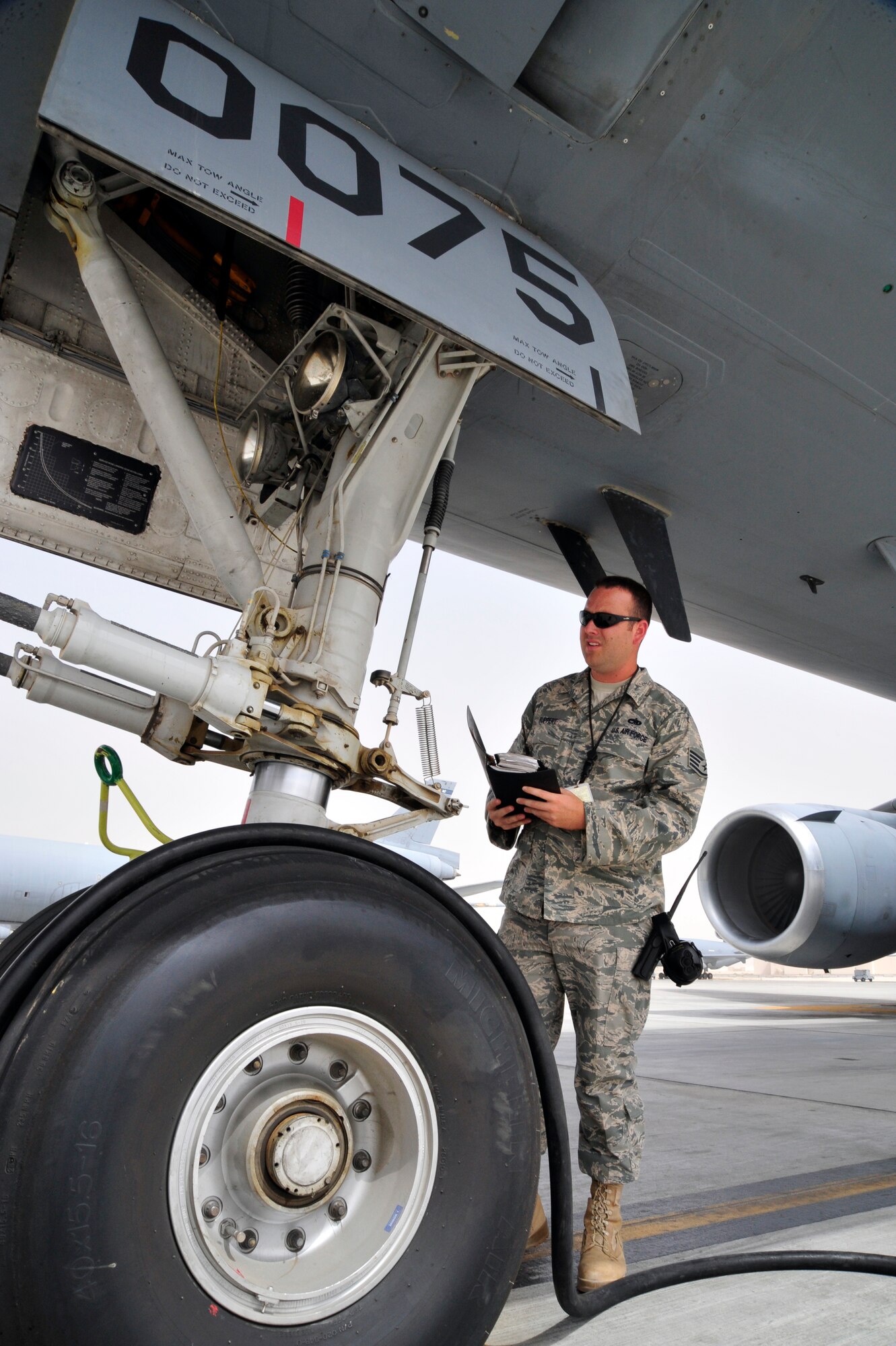 SOUTHWEST ASIA -Staff Sgt. Michael Ruppert, 380th Expeditionary Maintenance Group, observes the nose landing gear during a follow-up inspection here Oct. 6, 2009. Sergeant Ruppert evaluated a dropped object prevention (DOP) inspection, completed earlier by an aircraft maintenance technician. Sergeant Ruppert is deployed from McGuire Air Force Base, N.J., and grew up in Ft. Myers, Fla. (U.S. Air Force photo/Tech. Sgt. Charles Larkin Sr)
