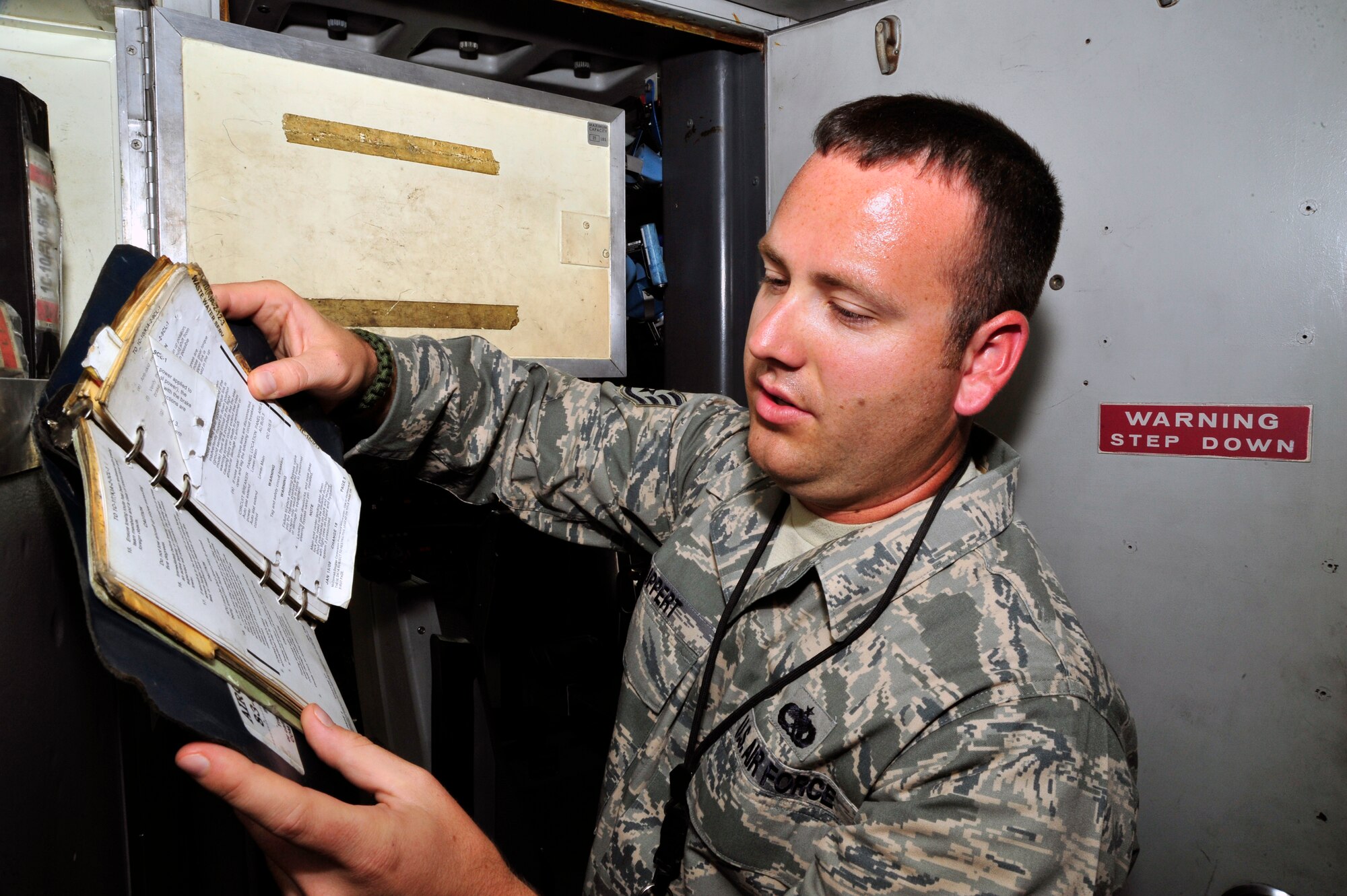 SOUTHWEST ASIA -Staff Sgt. Michael Ruppert, 380th Expeditionary Maintenance Group, searches for the correct technical data required to complete a follow- up inspection here Oct. 6, 2009. Sergeant Ruppert evaluated a dropped object prevention (DOP) inspection, completed earlier by an aircraft maintenance technician. Sergeant Ruppert is deployed from McGuire Air Force Base, N.J., and grew up in Ft. Myers, Fla. (U.S. Air Force photo/Tech. Sgt. Charles Larkin Sr)