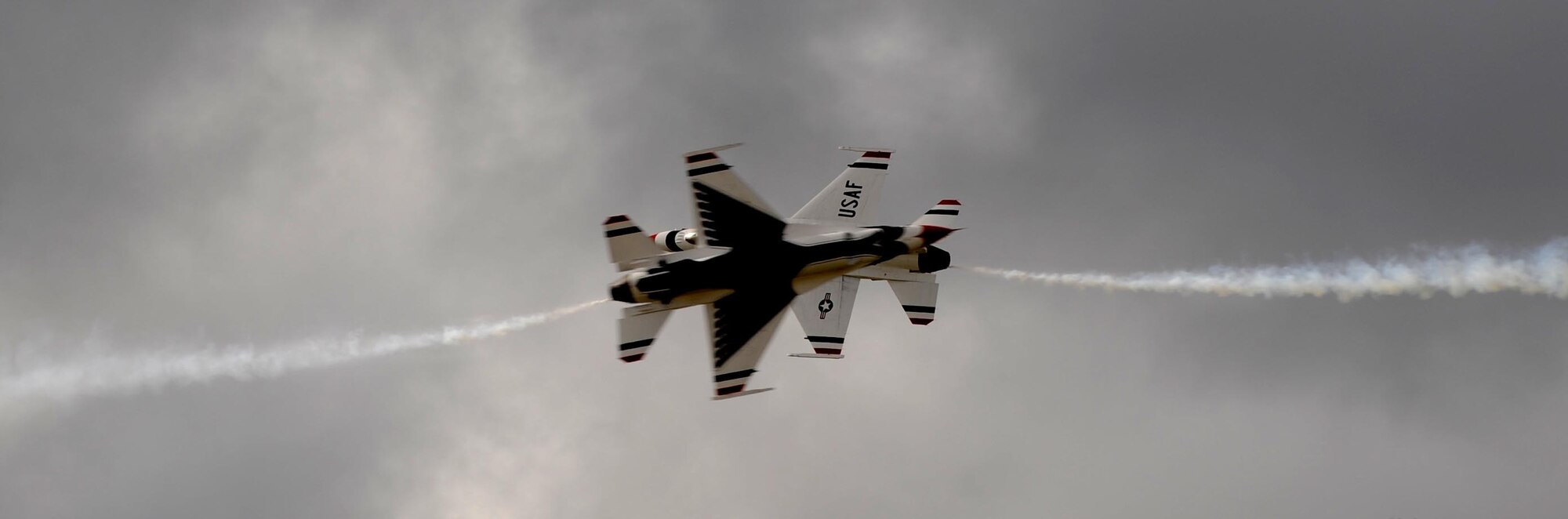 ANDERSEN AIR FORCE BASE, Guam – Air Force Thunderbirds #5 and #6 perform the opposing knife edge pass during the Team Andersen Air Show '09 "Air Power over the Marianas" here on Andersen Air Force Base, Guam, Oct. 7. The U.S. Air Force's aerial demonstration team, the Thunderbirds, were one of four aerial demonstration teams to perform for the audience.  (U.S. Air Force photo by Senior Airman Christopher Bush)

