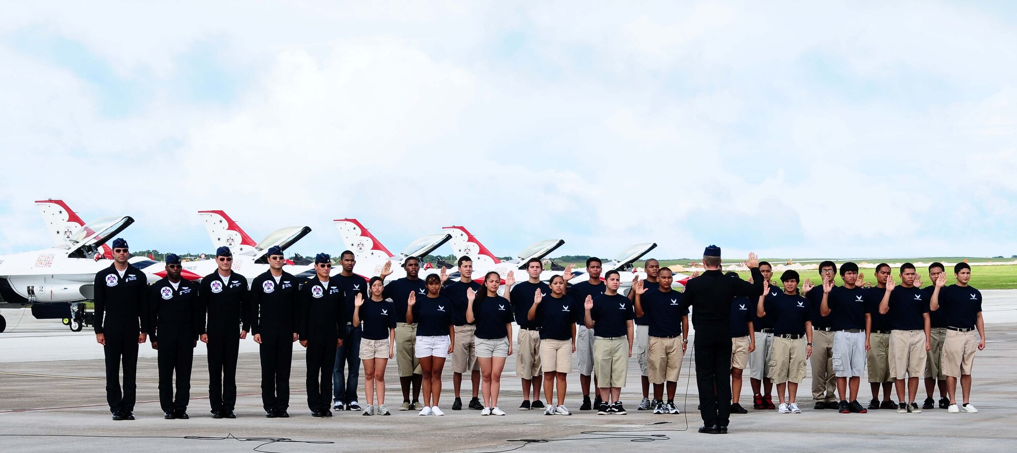 ANDERSEN AIR FORCE BASE, Guam - Lt. Col. Greg Thomas, U.S. Air Force Thunderbirds commander, enlists 22 young men and women into the U.S. Air Force here during the Team Andersen Air Show '09 "Air Power over the Marianas."  (U.S. Air Force photo by Senior Airman Nichelle Anderson)