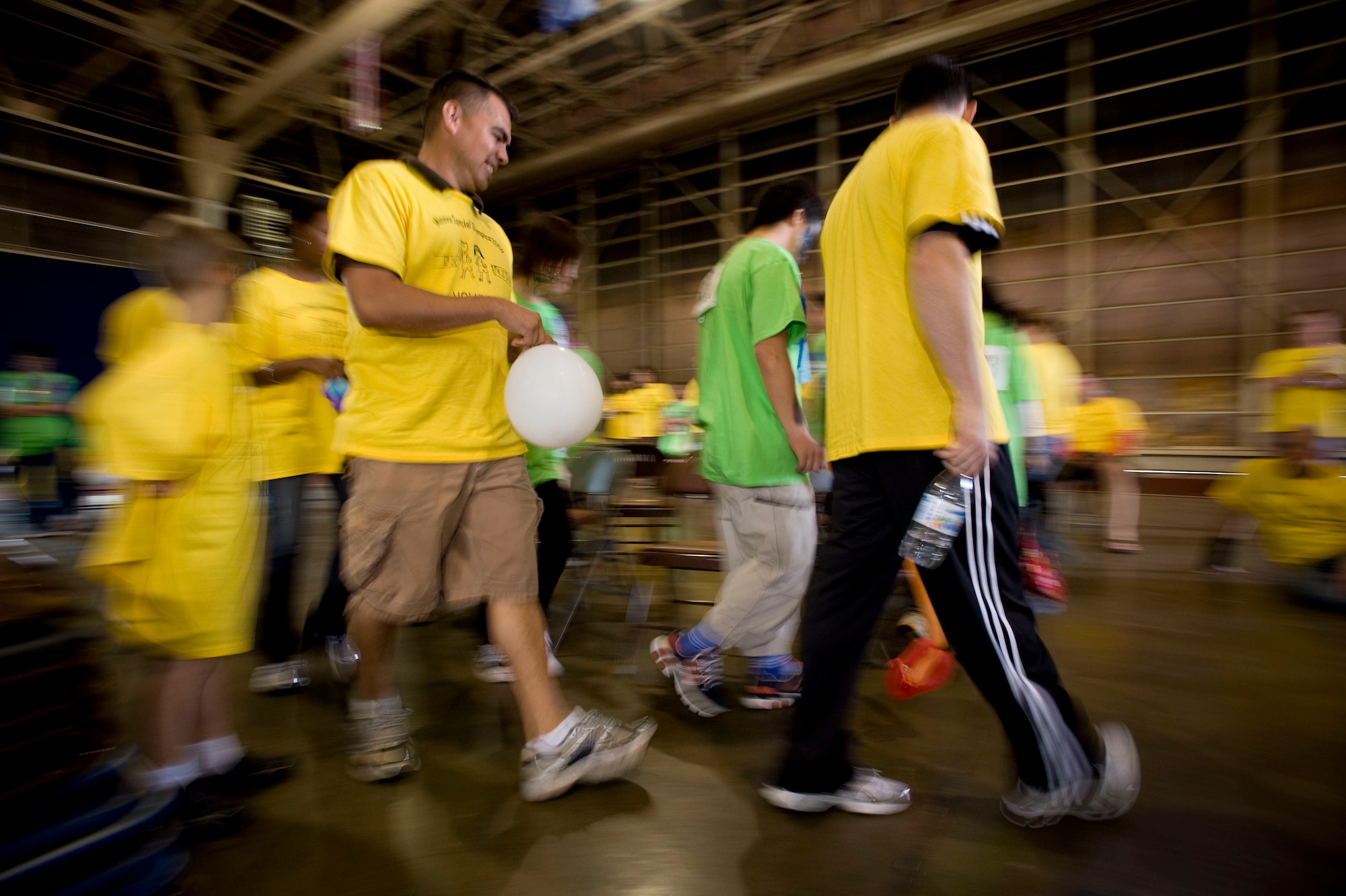 MISAWA AIR BASE, Japan -- Special Olympics athletes and their sponsors play musical chairs in Hangar 949 Oct. 3. The event offered many sporting events and different forms of entertainment throughout the day. (U.S. Air Force photo/Staff Sgt. Samuel Morse)