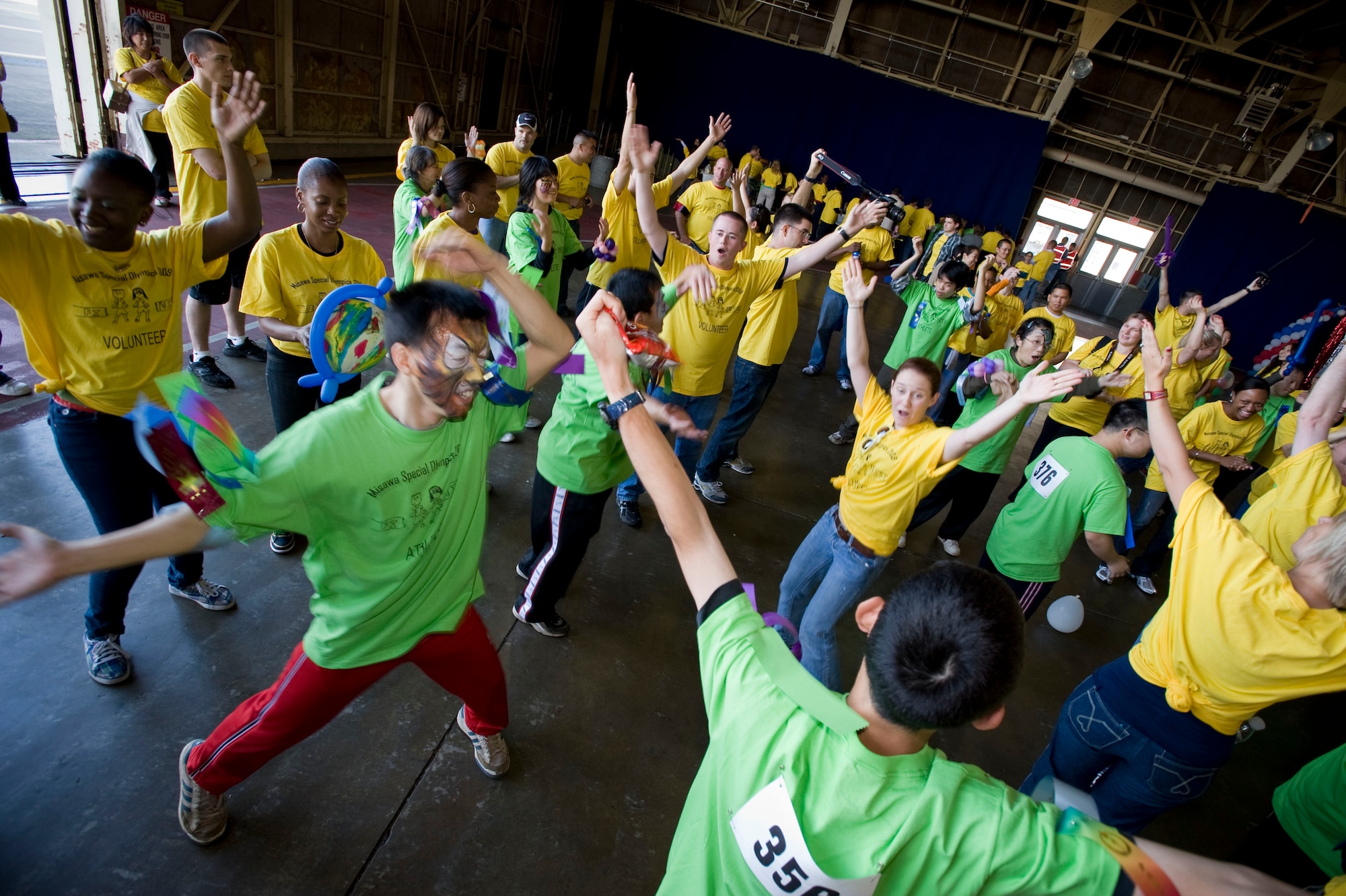 MISAWA AIR BASE, Japan -- Special Olympics athletes and their sponsors dance in Hanger 949 Oct. 3. The American sponsors taught the athletes various popular dances. (U.S. Air Force photo/Staff Sgt. Samuel Morse)