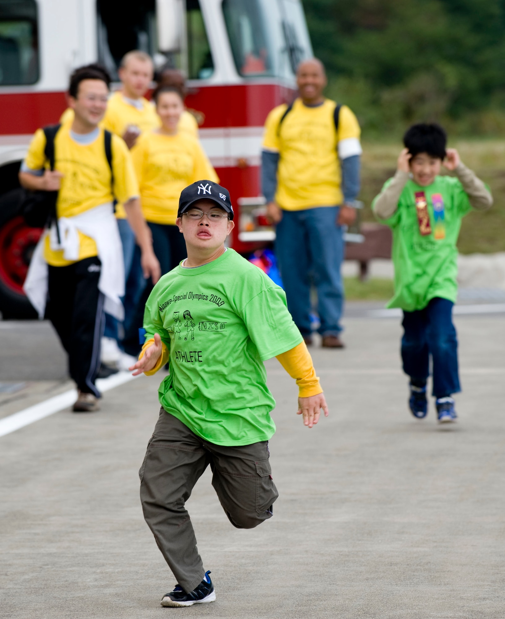 MISAWA AIR BASE, Japan -- A Special Olympics athlete runs the 50-meter dash outside Hangar 949 Oct. 3. More than 60 athletes from the local community participated in the 23rd annual Special Olympics at Misawa Air Base. (U.S. Air Force photo/Staff Sgt. Samuel Morse)