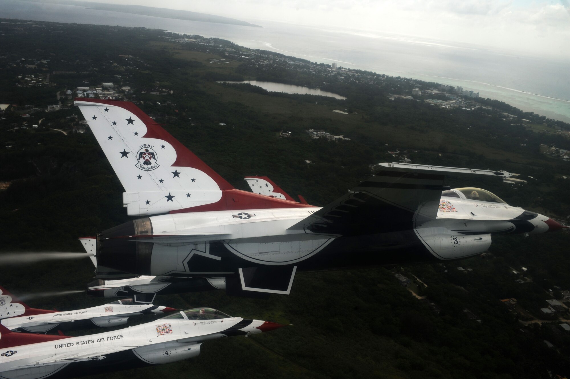 The U.S. Air Force Thunderbirds fly in formation over Saipan Oct. 6.  The Thunderbirds flew over Saipan before conducting their practice demonstration over Andersen Air Force Base, Guam.  The Thunderbirds are visiting Andersen AFB for the Team Andersen Air Show '09 on Oct. 7.  (Air Force photo by Staff Sgt. Kristi Machado)