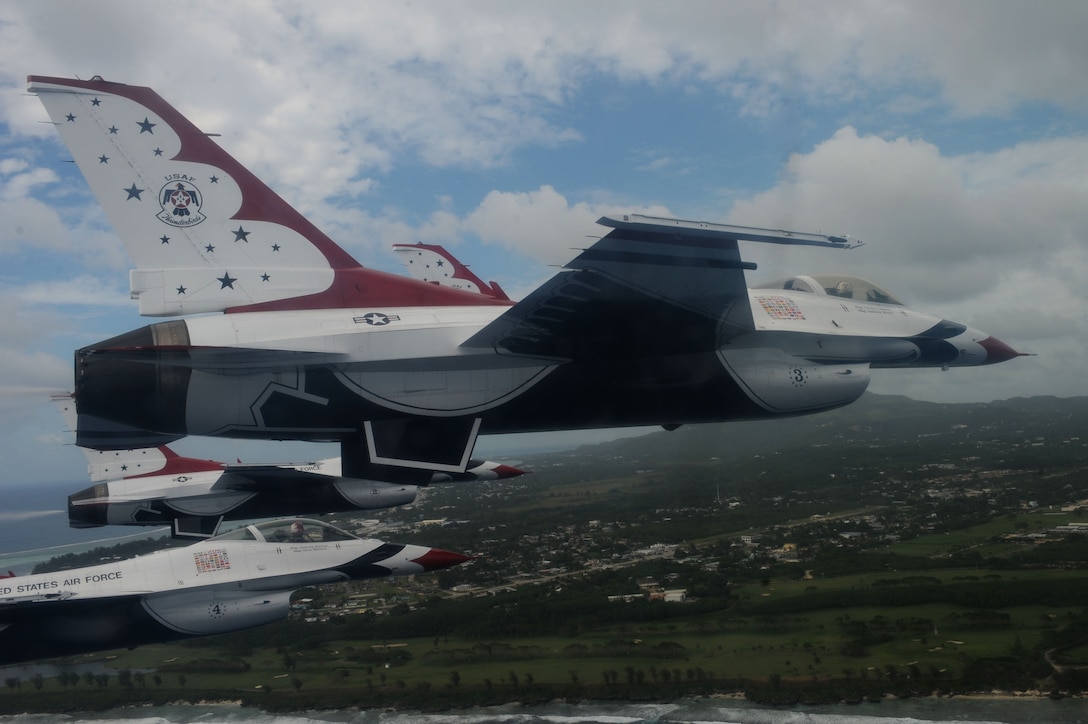 The U.S. Air Force Thunderbirds fly in formation over Saipan Oct. 6. The Thunderbirds flew over Saipan before conducting their practice demonstration over Andersen Air Force Base, Guam.  The Thunderbirds are visiting Andersen AFB for the Team Andersen Air Show '09 on Oct. 7.  (Air Force photo by Staff Sgt. Kristi Machado)
