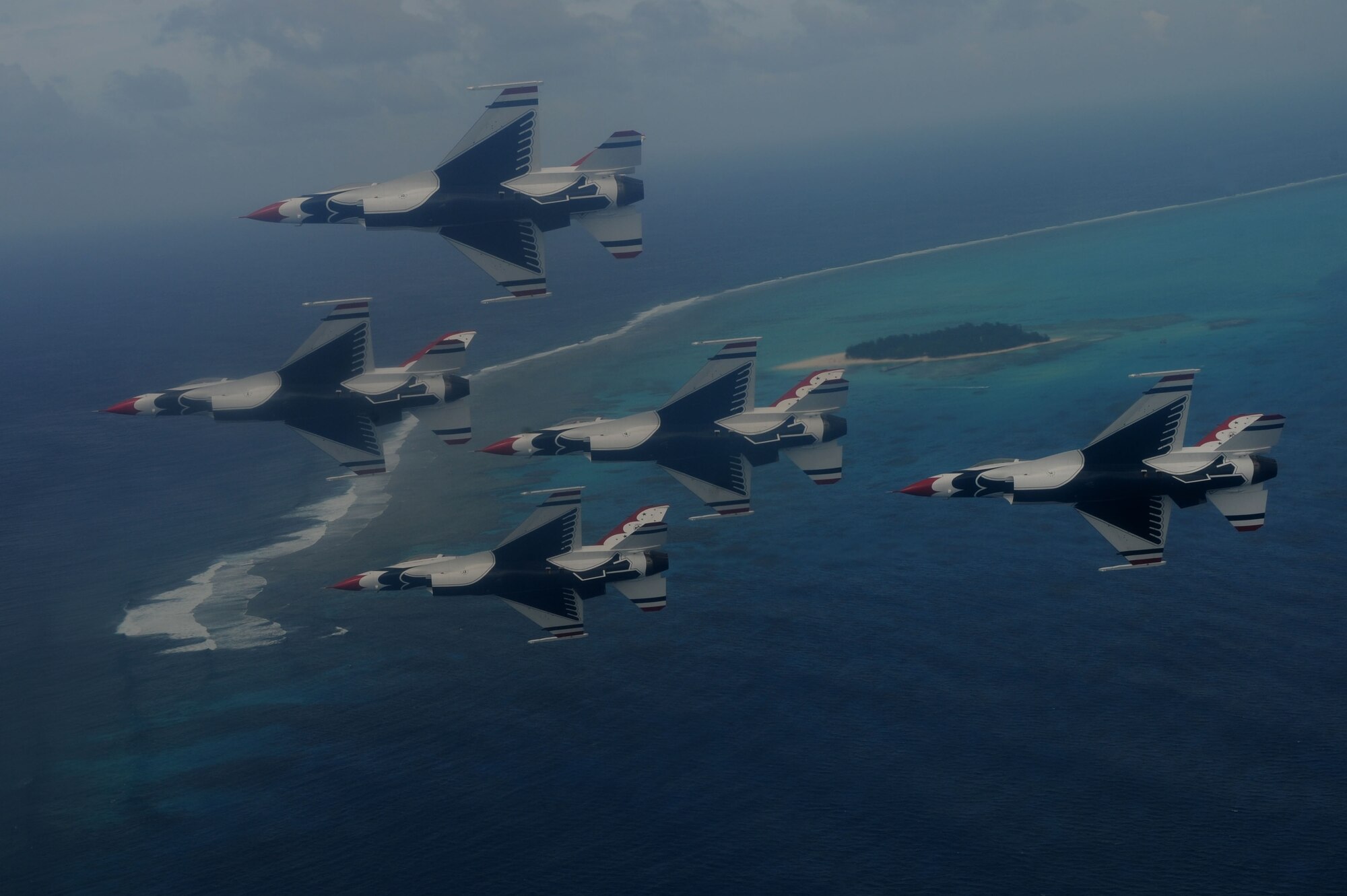 The U.S. Air Force Thunderbirds fly in formation on their way to Saipan Oct. 6.  The Thunderbirds flew over Saipan before conducting their practice demonstration over Andersen Air Force Base, Guam.  The Thunderbirds are visiting Andersen AFB for the Team Andersen Air Show '09 on Oct. 7.  (Air Force photo by Staff Sgt. Kristi Machado)