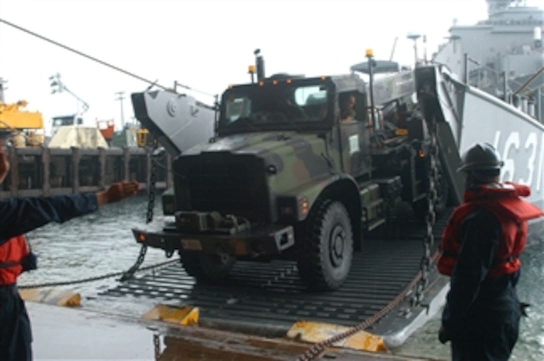 Crew members assigned to Utility Landing Craft 1631 unload U.S. Marines' equipment at Naval Base Subic Bay, Philippines, on Oct. 3, 2009.  Landing craft 1631 is part of the USS Denver (LPD 9) Amphibious Task Group, which was asked by the government of the Philippines to support humanitarian assistance operations in the wake of Typhoon Ketsana.  