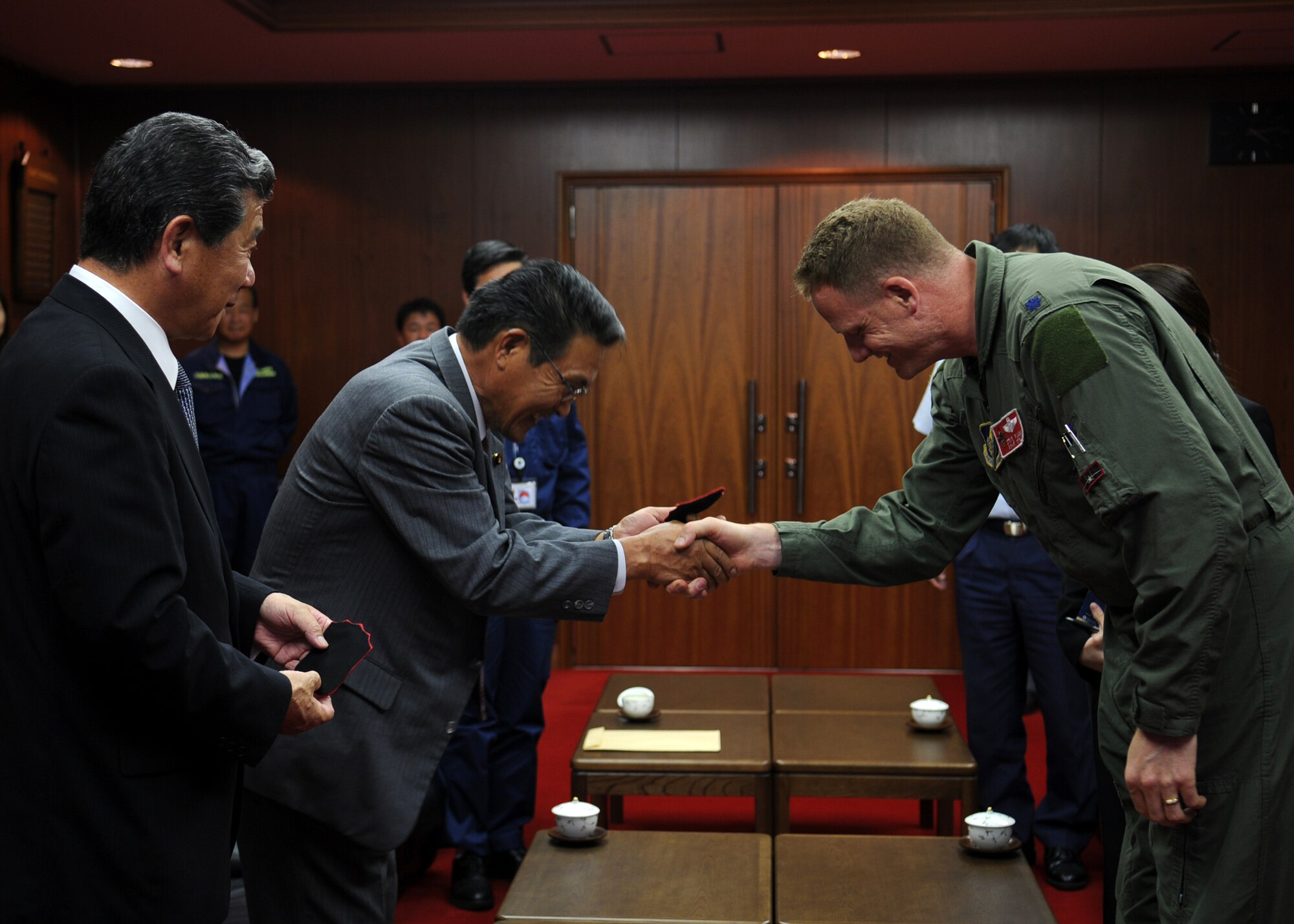 Lt. Col. Steve Plank, Det. Commander for ATR Hyakuri and pilot with the 67th Fighter Squadron, Kadena Air Base, Japan, presents squadron patches to Omitama City Mayor, Joichi Shimada, and Assembly Deputy Chairman, Tsutomu Nakamur, after meeting with them to discuss the events of the week, future bilateral training, and further cultural exchanges at Hyakuri Air Base, Japan, Oct. 07. The squadron is participating in an Aviation Training Relocation exercise between the U.S. Air Force and the Japan Air Self Defense Force from Oct. 5-9, 2009.

