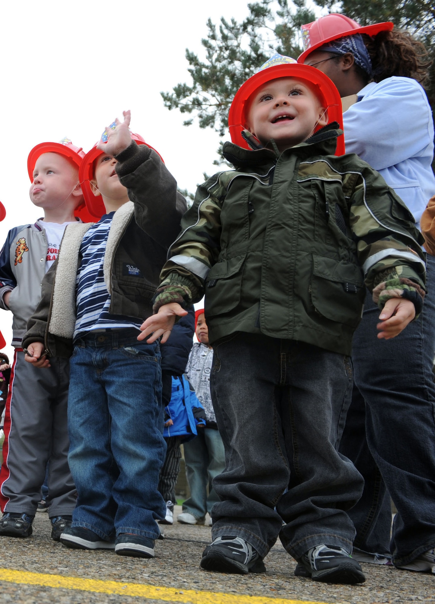 MOUNTAIN HOME AIR FORCE BASE, Idaho -- Aiden waits for a turn to go inside a fire truck with Sparky the fire dog during Fire Prevention Week Oct. 5 at the Child Development Center. This is the 88th year fire departments have observed Fire Prevention Week, making it the longest running public health and safety observance on record.(U.S. Air Force photo by Airman 1st Class Debbie Lockhart)