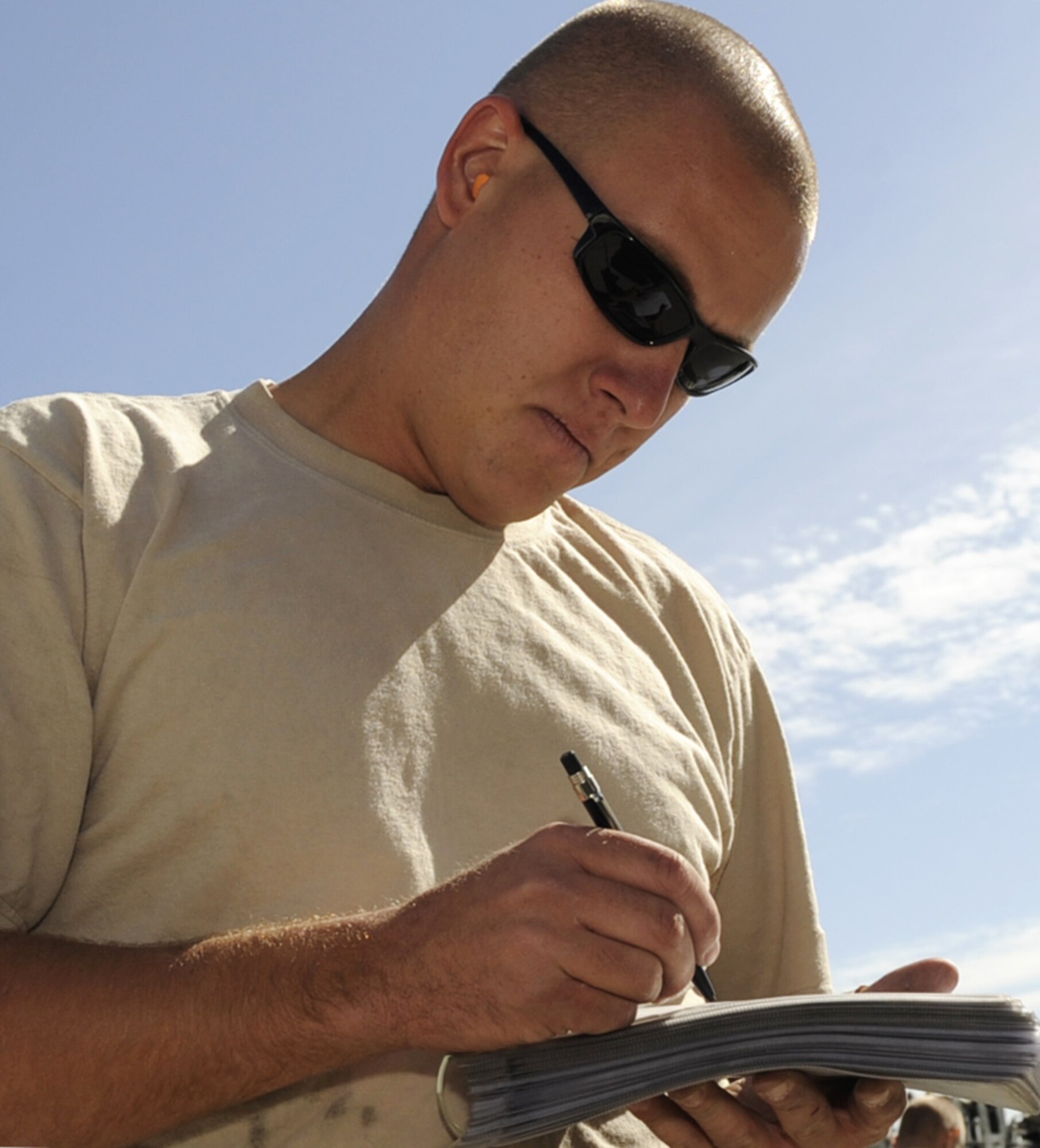 MOUNTAIN HOME AIR FORCE BASE, Idaho -- Staff Sgt. Bryan Gates, 390th  Aircraft Maintenance Unit weapons load crew chief, looks over a maintenance check list during the Weapons Load Crew Competition Oct. 2. The 428th Fighter Squadron went on to take its first victory winning the competition by only one point. (U.S. Air Force photo by Airman 1st Class Renishia Richardson)