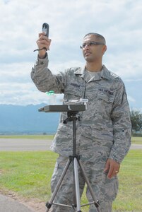 SOTO CANO AIR BASE, Honduras — Tech. Sgt Dasveer Parhar, an Air Force weatherman with the 612th Air Base Squadron, measures winds, temperature, dewpoint and pressure with a handheld Kestrel Oct. 5 in front of the base operations building. Sergeant Parhar was recently named the 12th Air Force NCO of the Quarter. He said he has been a weatherman for 11 years, and he likes how important weather is to the mission (U.S. Air Force photo/Staff Sgt. Chad Thompson).
