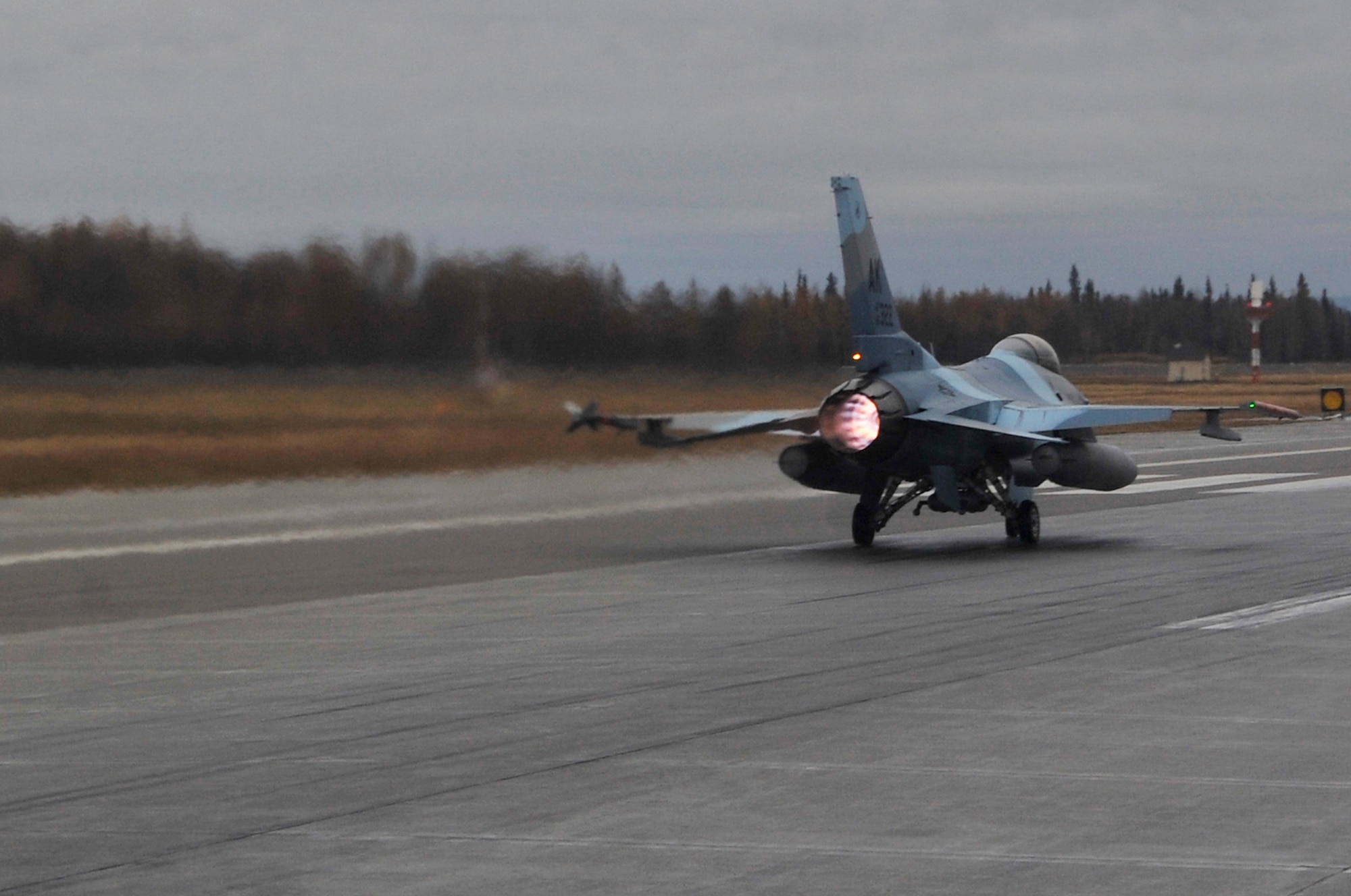 An F-16 Fighting Falcon Aggressor takes off from the runway during RED FLAG-Alaska 10-1 Oct. 8, 2009, Eielson Air Force Base, Alaska. RF-A is a Pacific Air Forces-directed field training exercise poised at giving aircrews their first 10 flights in simulated air combat conditions. (U.S. Air Force photo/Staff Sgt. Christopher Boitz)