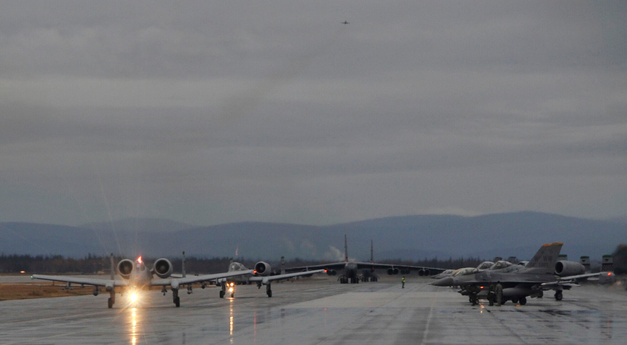 Aircraft participating in RED FLAG-Alaska 10-1 taxi to the runway Oct. 8, 2009. RF-A provides participants 67,000 square miles of airspace, one conventional bombing range and two tactical bombing ranges containing more than 400 different types of targets and more than 30 threat simulators. (U.S. Air Force photo/Staff Sgt. Christopher Boitz)