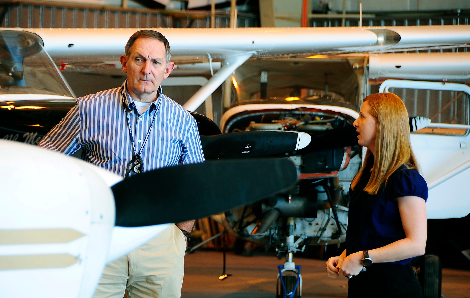 HOLLOMAN AIR FORCE BASE, N.M. -- Amber Martin of the Holloman Aero Club discusses pilot training with Larry Culver of the Federal Aviation Administration Sep. 22. The Aero Club graduates an average of 25 students annually and Mr. Culver came to certify the testing methods. (U.S.Air Force photo by Tech. Sgt. Chris Flahive)