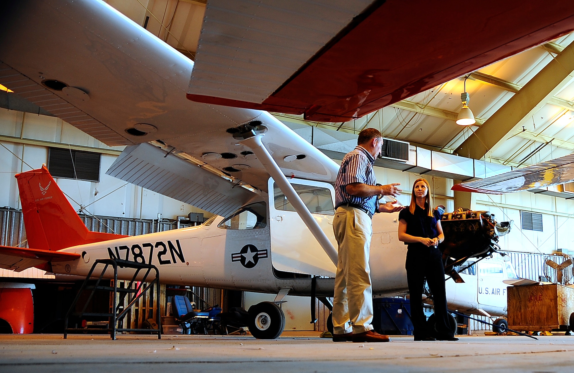 HOLLOMAN AIR FORCE BASE, N.M. -- Amber Martin reviews training and testing materials with Larry Culver Sep. 22. Mr. Culver works for the Federal Aviation Administration and came to certify the club's testing center. (U.S. Air Force photo by Tech. Sgt. Chris Flahive)