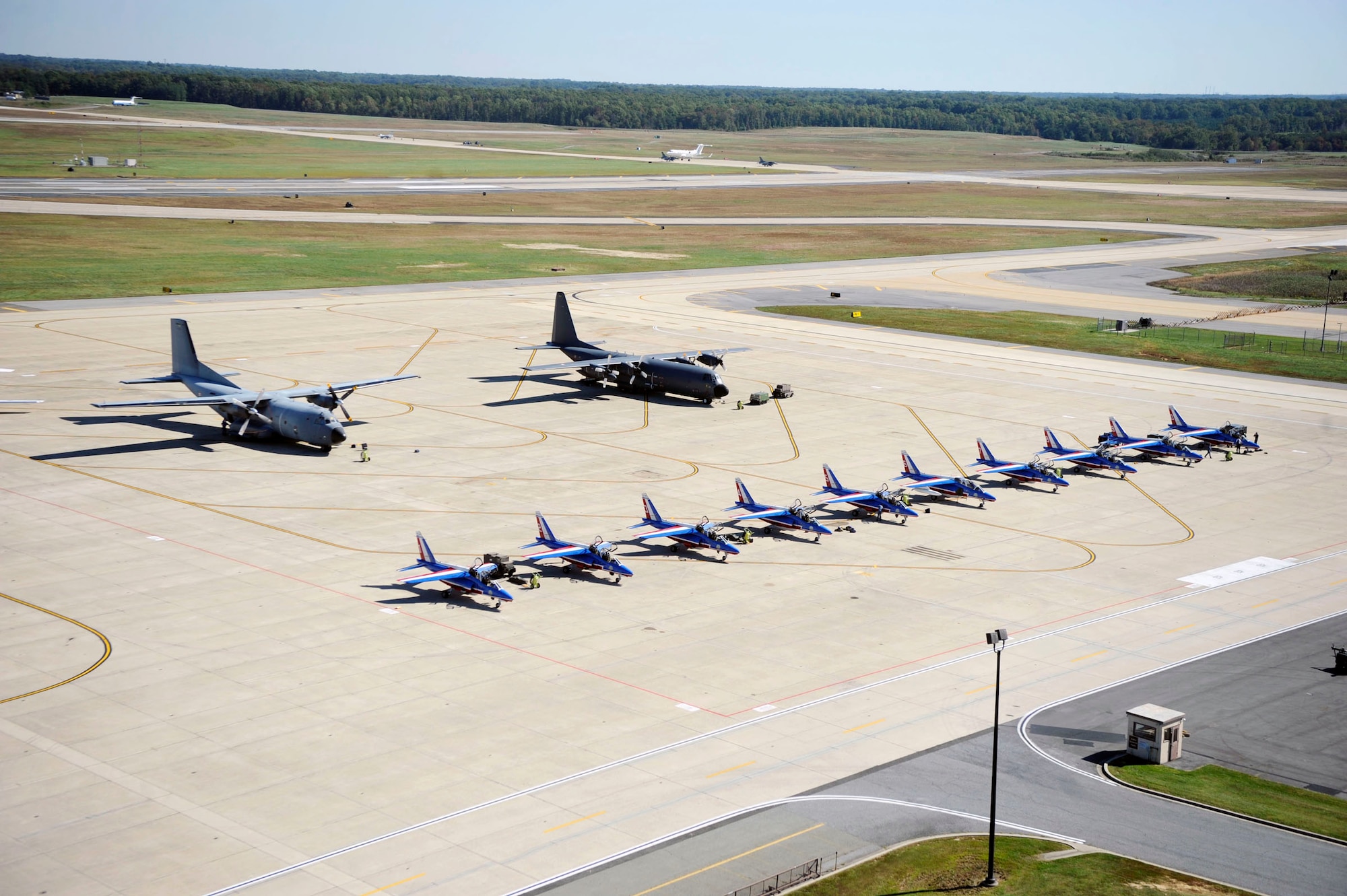 Ten Dassault/Dornier Alpha Jet's, belonging to the Patrouille Acrobatique de France ("French Acrobatic Patrol") of the French air force sit on the tarmac at Joint Base Andrews Naval Air Facilty Washington prior to a tribute flight over Yorktown, Va.  The precision acrobatic team, commonly referred to as "Patrouille de France", provided incentive flights to Lt. Gen. Mark D. "Shack" Shackelford and Maj. Gen. Johnny A. Weida during the teams trip to the United States to perform the flyover celebrating an age-old alliance between the two countries. (U.S. Air Force photo by Senior Airman Steven R. Doty)