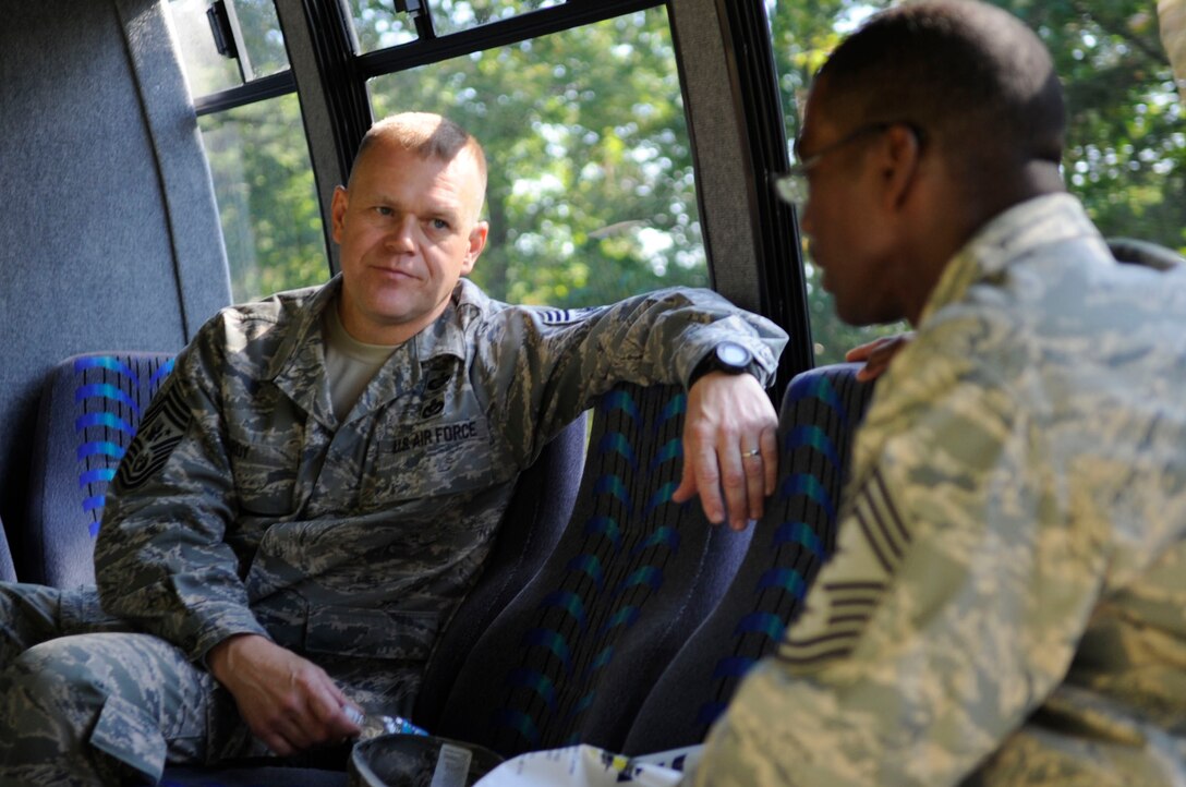 Chief Master Sergeant of the Air Force James Roy talks with Chief Master Sergeant James Davis, 316th Wing and Joint Base Andrews Naval Air Facility Washington command chief, Wednesday during a visit.  Chief Roy took time to discuss various challenges and goals as chief master sergeant of the Air Force with the leaders of Joint Base Andrews.  (U.S. Air Force photo by Senior Airman Steven R. Doty)