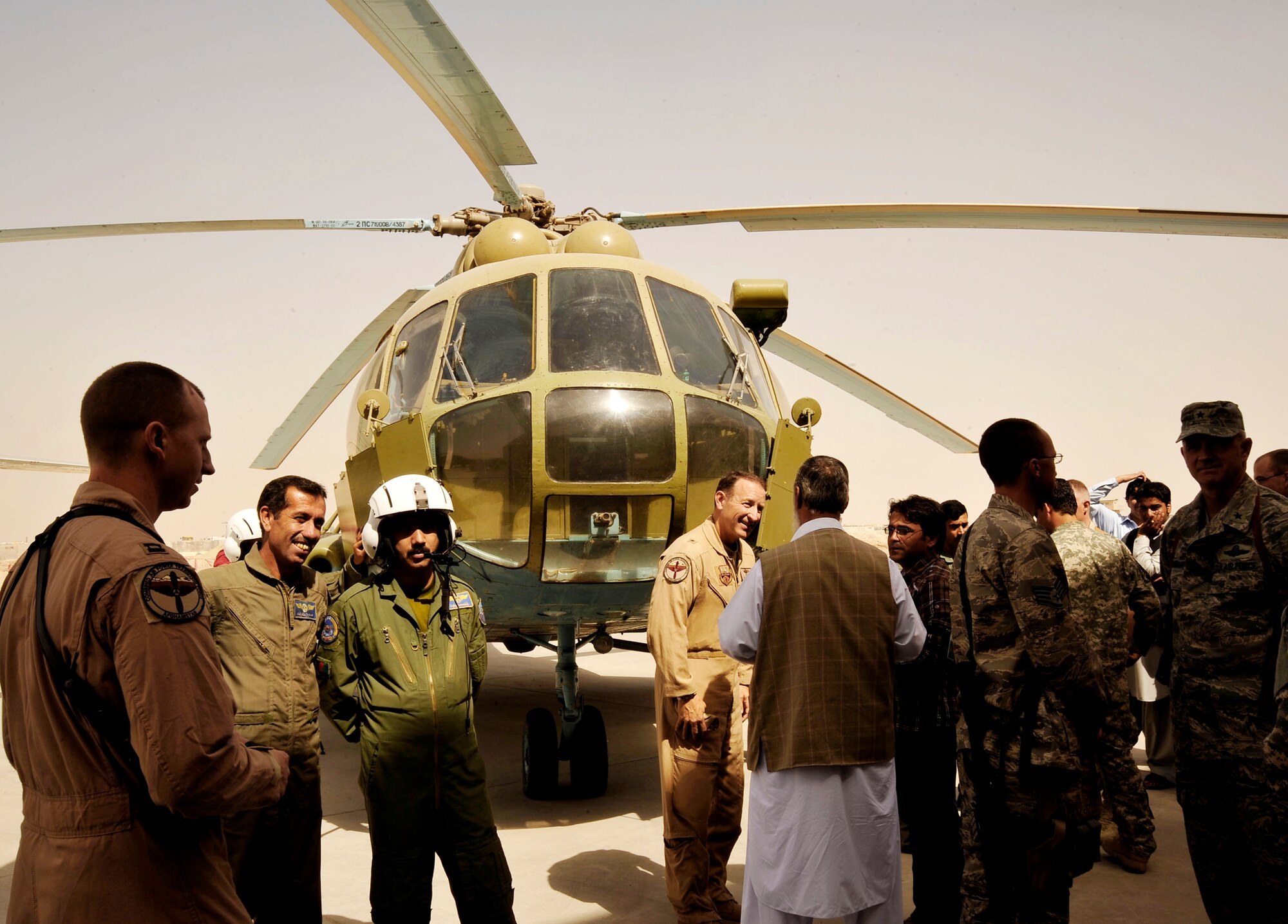 Afghan and coalition servicemembers and local dignitaries celebrate the activation of the Afghanistan National Army Air Corps' second wing Oct. 5, 2009, at Kandahar Airfield, Afghanistan. The primary mission of the new wing is to move troops and supplies around the region and support smaller Afghan military detachments. (U.S. Air Force photo/Staff Sgt. Angelita Lawrence)