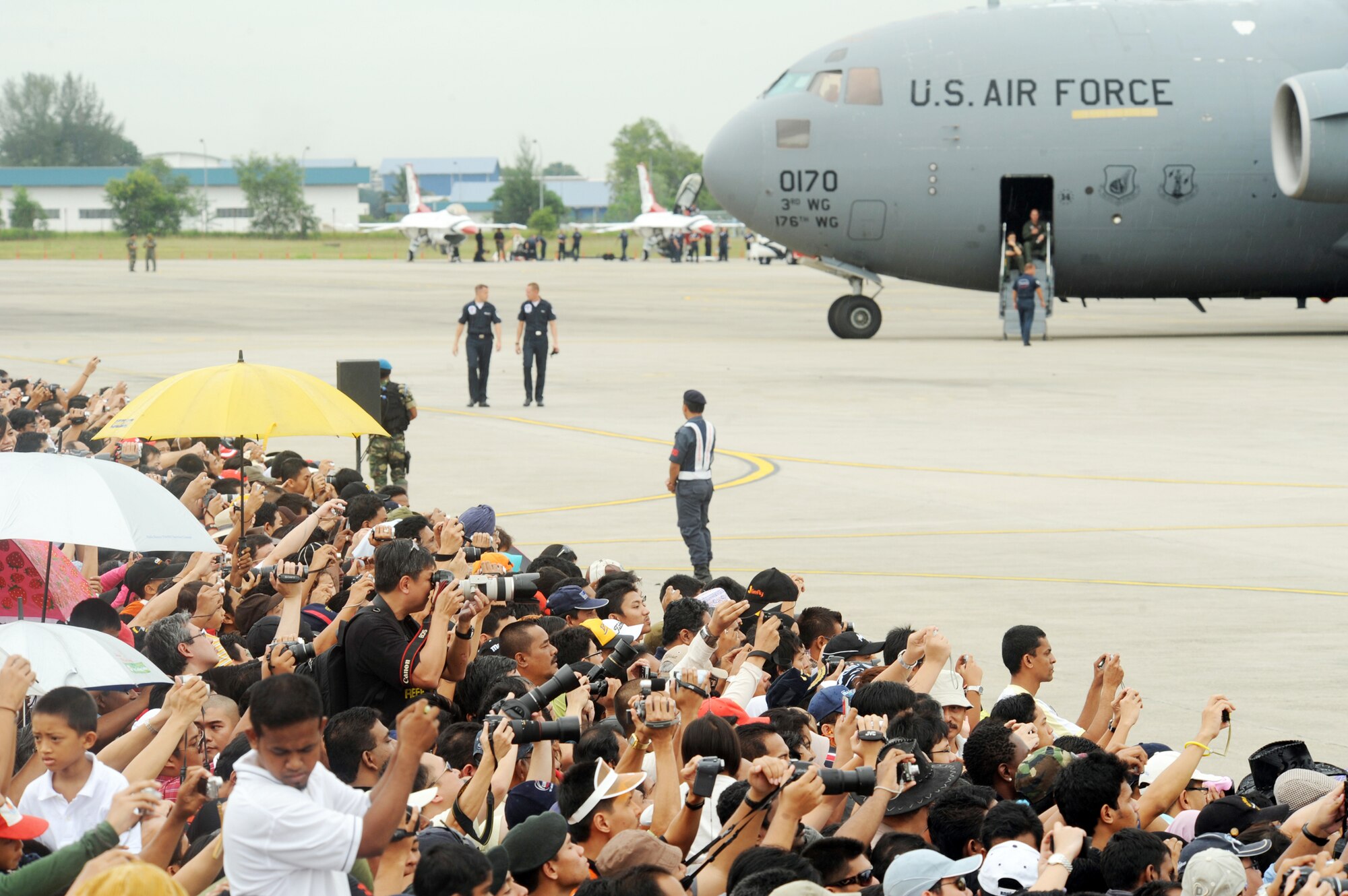 The crowd cheers as U.S. Air Force Air Demonstration Squadron, the Thunderbirds, get ready to take off Oct. 2, 2009, in Kuala Lumpur, Malaysia. The Thunderbirds' tour of the Pacific aids in fostering friendships with U.S. allies, which helps to promote security and stability throughout the region. (U.S. Air Force photo/Staff Sgt. Kristi Machado)