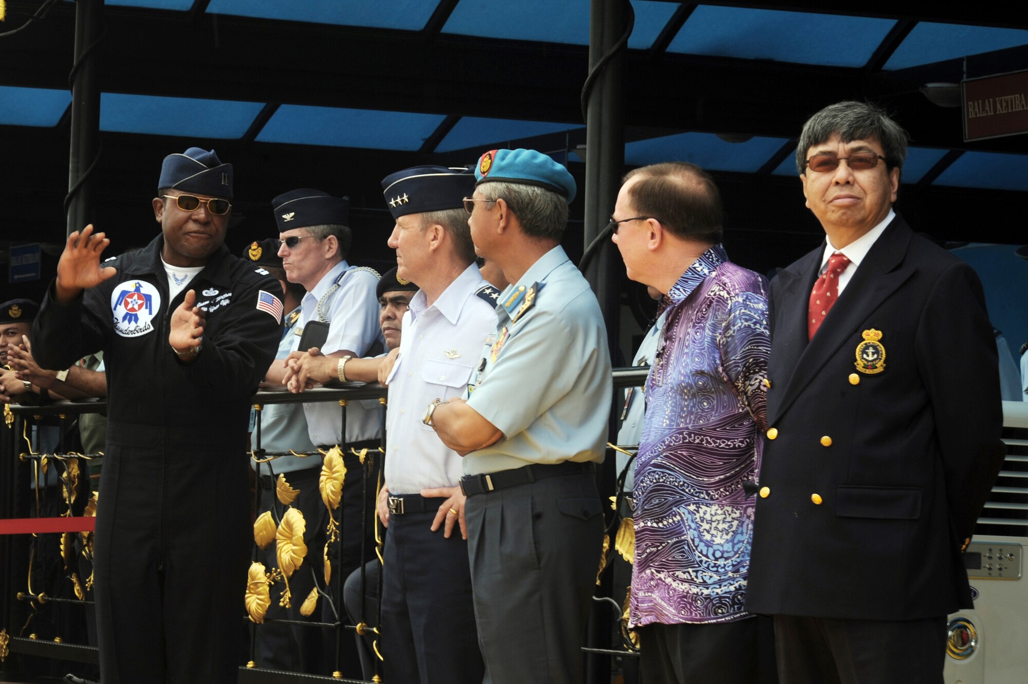 Capt. Jason McCree explains manuevers to Malaysian government officials during the airshow Oct. 3, 2009, in Kuala Lumpur, Malaysia. Also present was Lt. Gen. Herbert J. "Hawk" Carlisle, the 13th Air Force commander. The U.S. Air Force Air Demonstration Squadron, the Thunderbirds, participated in the Malaysian air show. Captain McCree is Thunderbird No. 12. (U.S. Air Force photo/Staff Sgt. Kristi Machado) 