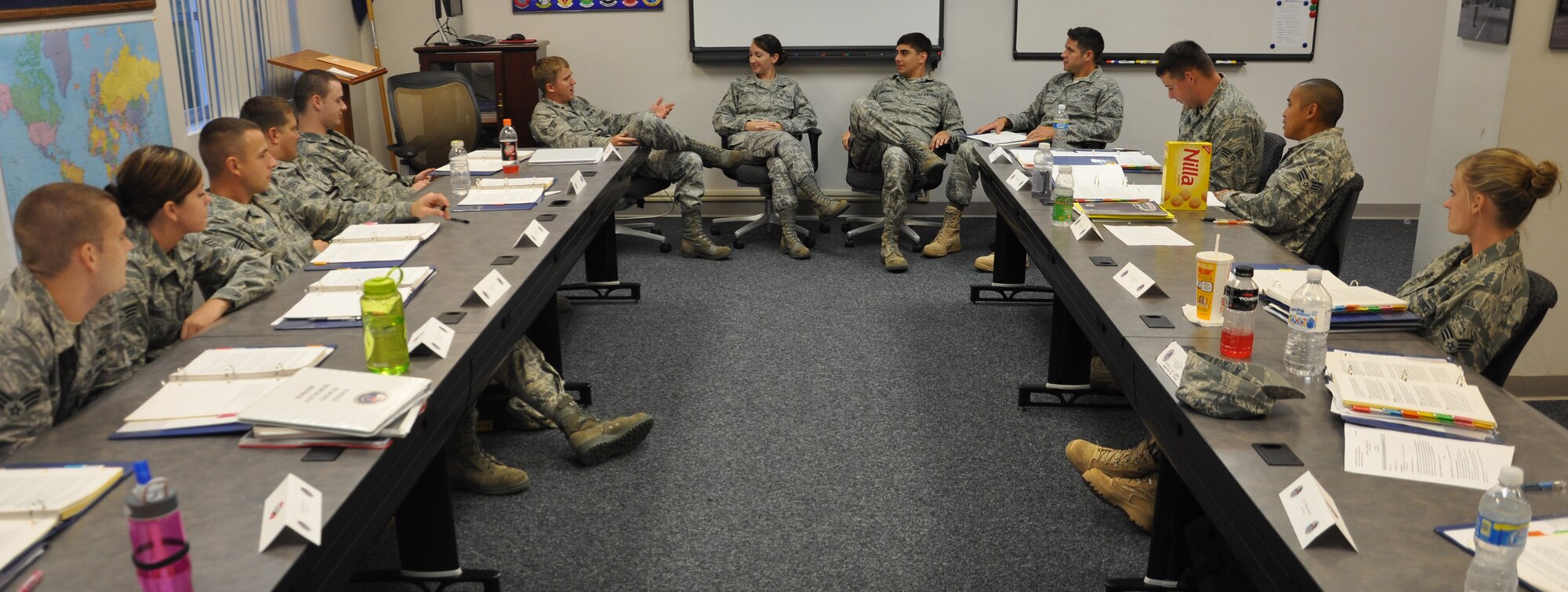 Staff Sgt. Lisa Kilpatrick, Airman Leadership School instructor, leads a discussion on the different ways non-commissioned officers and future supervisors can handle conflicts in the workplace Oct. 8 here. The five-week course will cover roles and responsibilities of non-commissioned officers, dress and appearance, drill and community service. (U.S. Air Force photo/Staff Sgt. Bryan Franks)