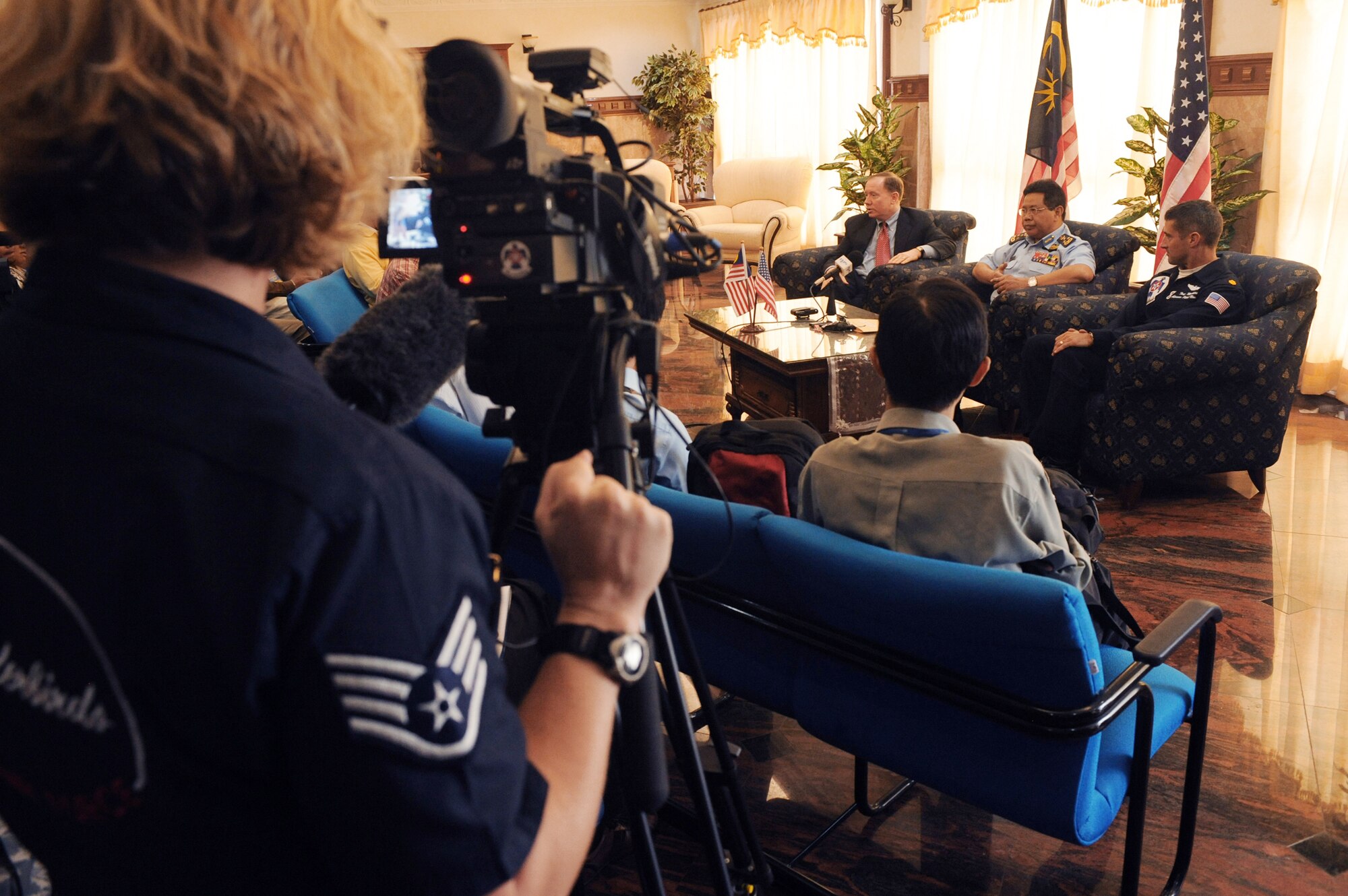 Maj. Tony Mulhare (right) particpates in a press conference with the Malaysian government and media Oct. 1, 2009, in Kuala Lumpur, Malaysia. The .S. Air Force Air Demonstration Squadron, the Thunderbirds, participated in the Malaysian air show. The Thunderbirds' tour of the Pacific aids in fostering friendships with U.S. allies, which helps to promote security and stability in the region. (U.S. Air Force photo/Staff Sgt. Kristi Machado) 
