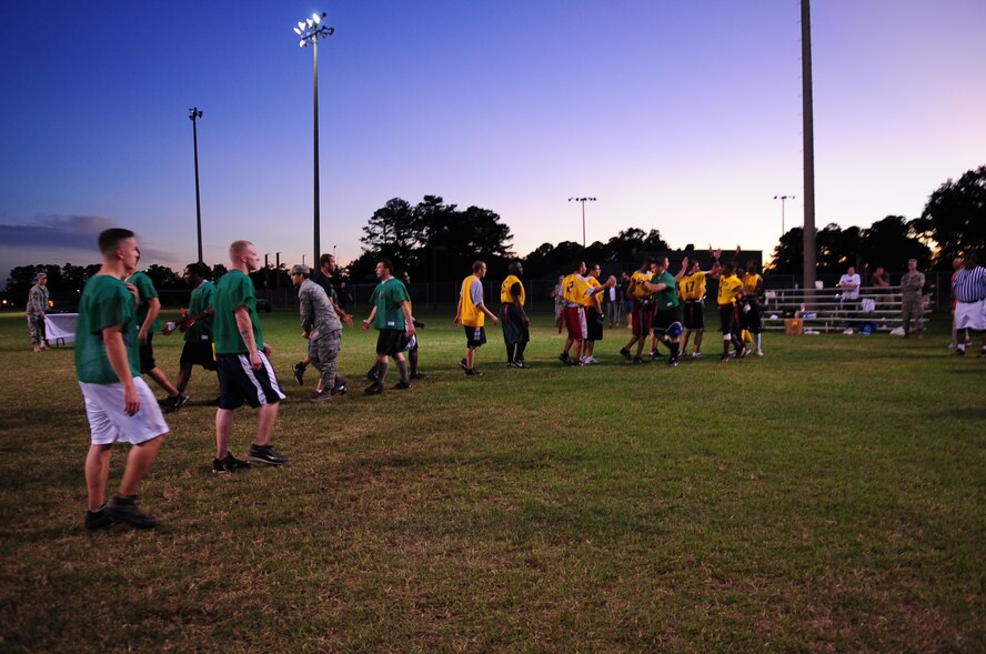 Members of the 4th Component Maintenance Squadron (in green) and the 4th Aircraft Maintenance Squadron intramural flag football teams shake hands after the championship game at Seymour Johnson Air Force Base, N.C., Oct. 7, 2009. (U.S. Air Force photo/Airman 1st Class Rae Perry)