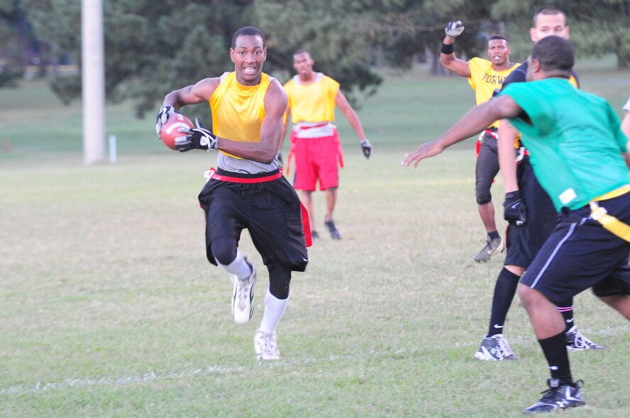 Anthony Banks, 4th Aircraft Maintenance Squadron’s intramural flag football team wide receiver, runs after intercepting the ball during the championship game at Seymour Johnson Air Force Base, N.C., Oct. 7, 2009.  The 4th AMXS played against the 4th Component Maintenance Squadron in the final game of the season. (U.S. Air Force photo/Airman 1st Class Rae Perry)