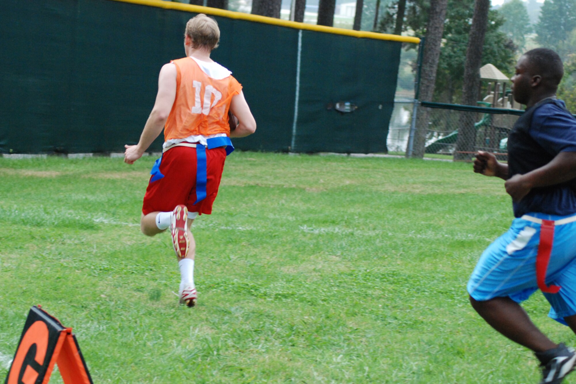 Gill Bozeman of the 22nd Air Force flag football team runs 40 yards for the final touchdown of the evening against the Clay National Guard Center Allstars Oct. 6. 22nd AF defeated the CNGC Allstars 18-6. (U.S. Air Force photo/Tech. Sgt. James Branch)