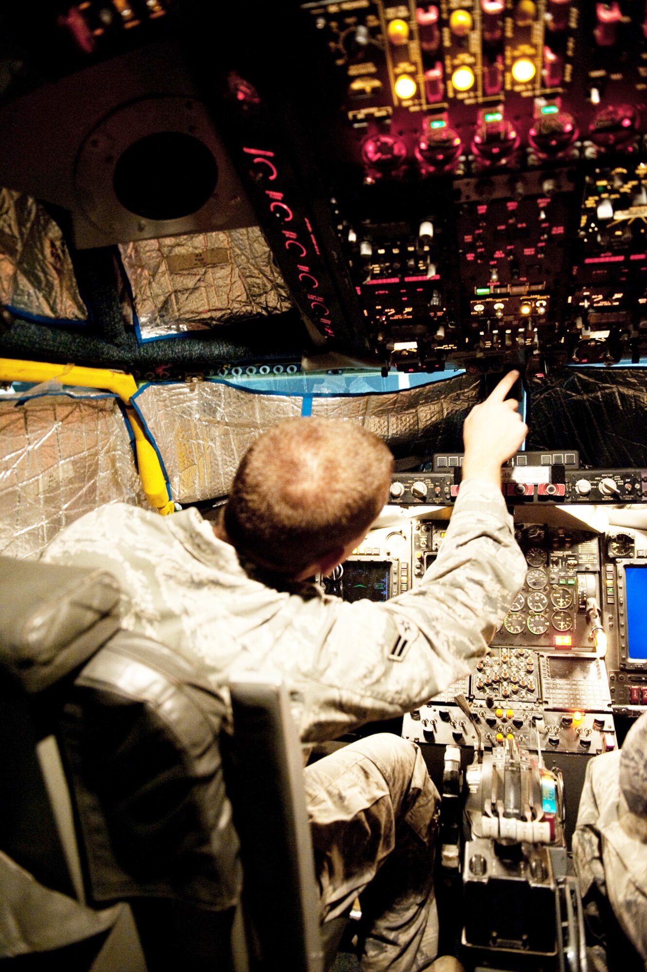 Airman 1st Class Jeremy Lowe conducts a post-flight inspection on a RC-135V/W Rivet Joint Oct. 7, 2009, at an air base in Southwest Asia. Airman Lowe helped mark Oct. 7 as the 7,000th consecutive day the RC-135 has provided commanders in the U.S. Central Command area of responsibility near real-time on-scene intelligence collection, analysis and dissemination. Airman Lowe is assigned to the 55th Aircraft Maintenance Unit deployed from Offutt Air Force Base, Neb. (U.S. Air Force photo/Staff Sgt. Robert Barney) 