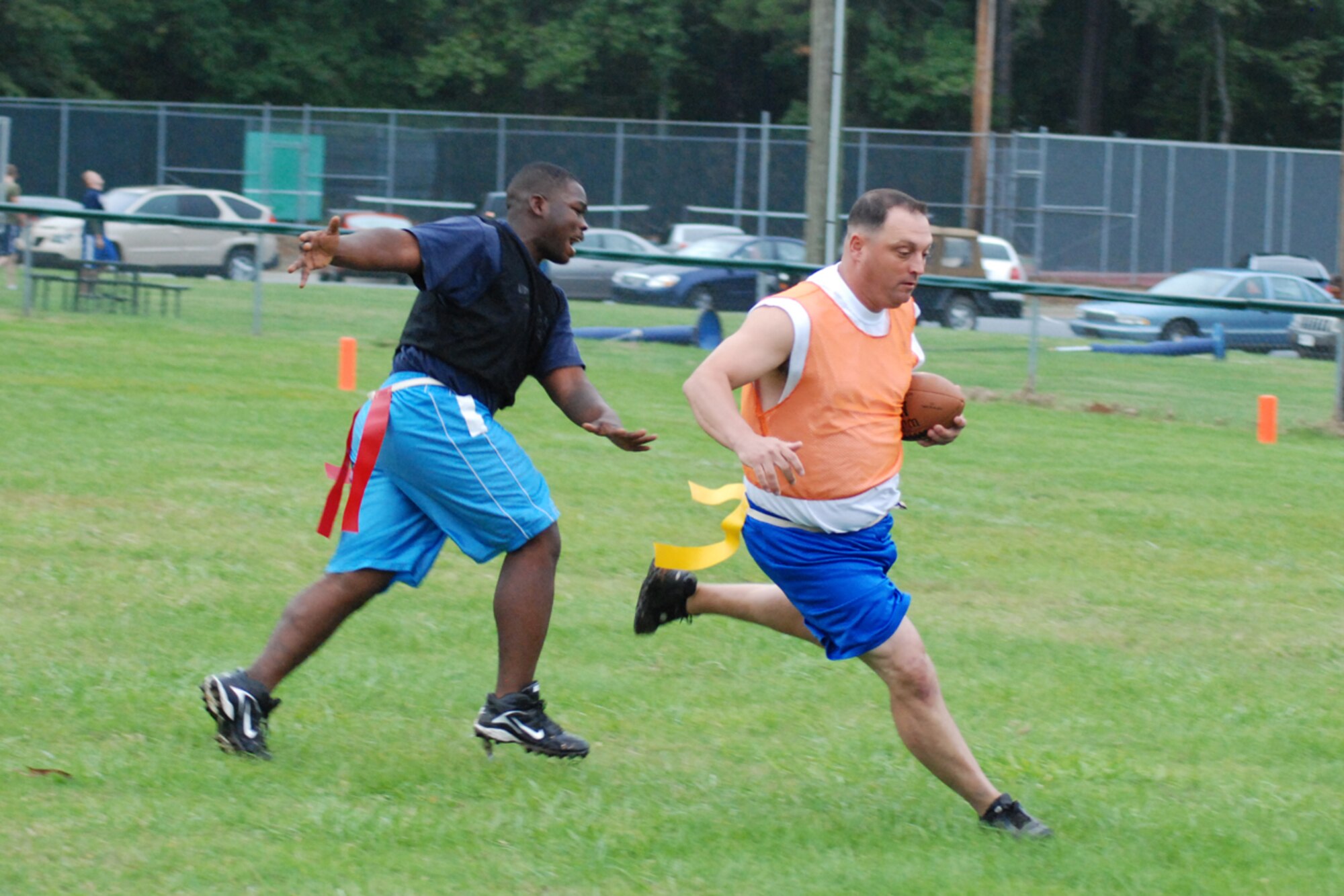 Scott Douglas of the 22nd Air Force flag football team runs 30 yards for a first down against the Clay National Guard Center Allstars Oct. 6. 22nd AF defeated the CNGC Allstars 18-6. (U.S. Air Force photo/Tech. Sgt. James Branch)
