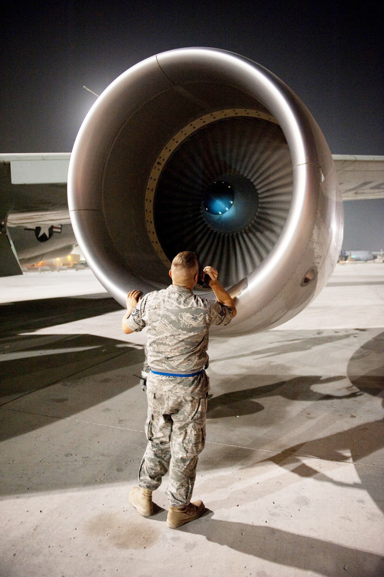 Staff Sgt. Michael Palmer inspects an RC-135V/W Rivet Joint for damage after it returned from a mission Oct. 7, 2009, at an air base in Southwest Asia. Sergeant Palmer is assigned to the 55th Aircraft Maintenance Unit deployed from Offutt Air Force Base, Neb. (U.S. Air Force photo/Staff Sgt. Robert Barney) 