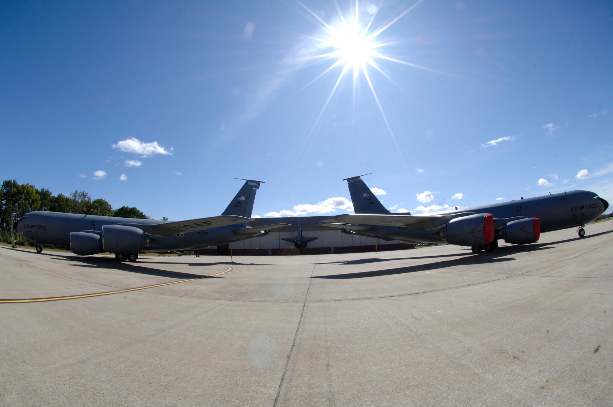 KC-135 Stratotankers from Pease Air National Guard Base, N.H., and McConnell Air Force Base, Kan., stand tail to tail Oct. 2, 2009, at Pease. The aircraft were a backdrop for a military activation ceremony that stood up the 64th Air Refueling Squadron. The 64th ARS is the first of three active-duty air refueling squadrons to become associate units to ANG KC-135 Stratotanker wings by September 2011. (U.S. Air Force photo by Staff Sgt. Amanda Currier)