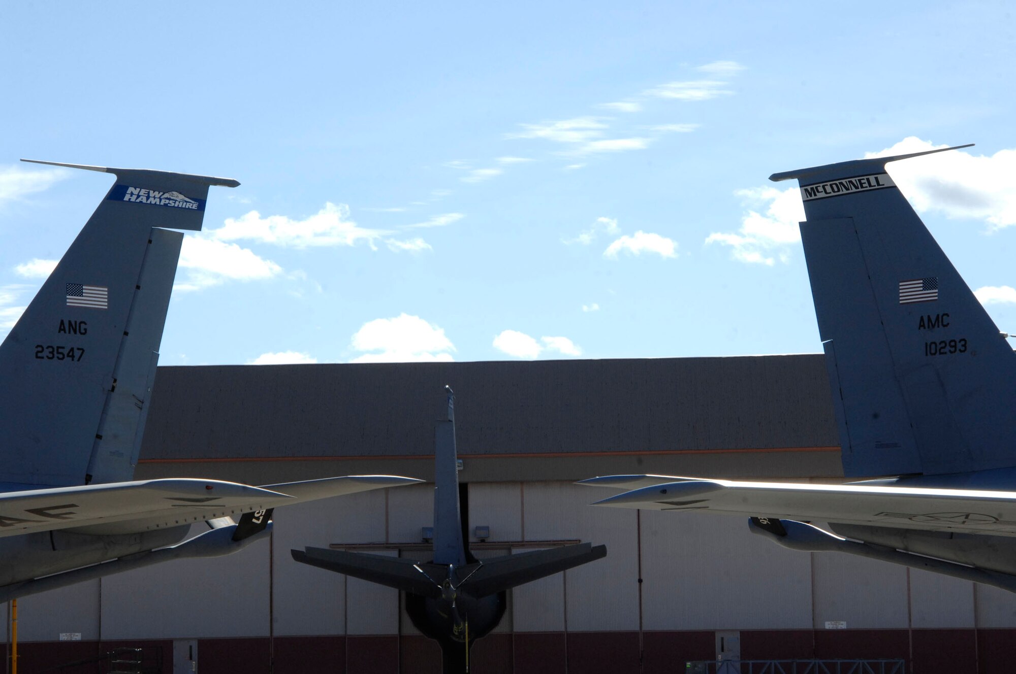 KC-135 Stratotankers from Pease Air National Guard Base, N.H., and McConnell Air Force Base, Kan., stand tail to tail Oct. 2, 2009, at Pease. The aircraft served as a backdrop for a military ceremony that stood up the 64th Air Refueling Squadron, the first active-duty Air Force unit to return to Pease since 1991. (U.S. Air Force photo by Staff Sgt. Amanda Currier)