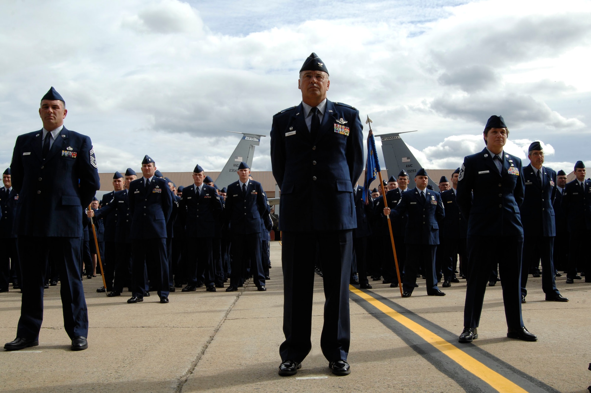 Members of the 157th Air Refueling Wing, Pease Air National Guard Base, N. H., stand at parade rest, Oct. 2, 2009, during a ceremony activating the 64th Air Refueling Squadron at Pease. Airmen from Air Mobility Command bases around the globe, including McConnell, recently moved to Pease to form the 64th ARS, the first active-duty unit to return to Pease since 1991. Once the squadron is at full strength, it will have between 120 and 130 members. (U.S. Air Force photo by Staff Sgt. Amanda Currier)