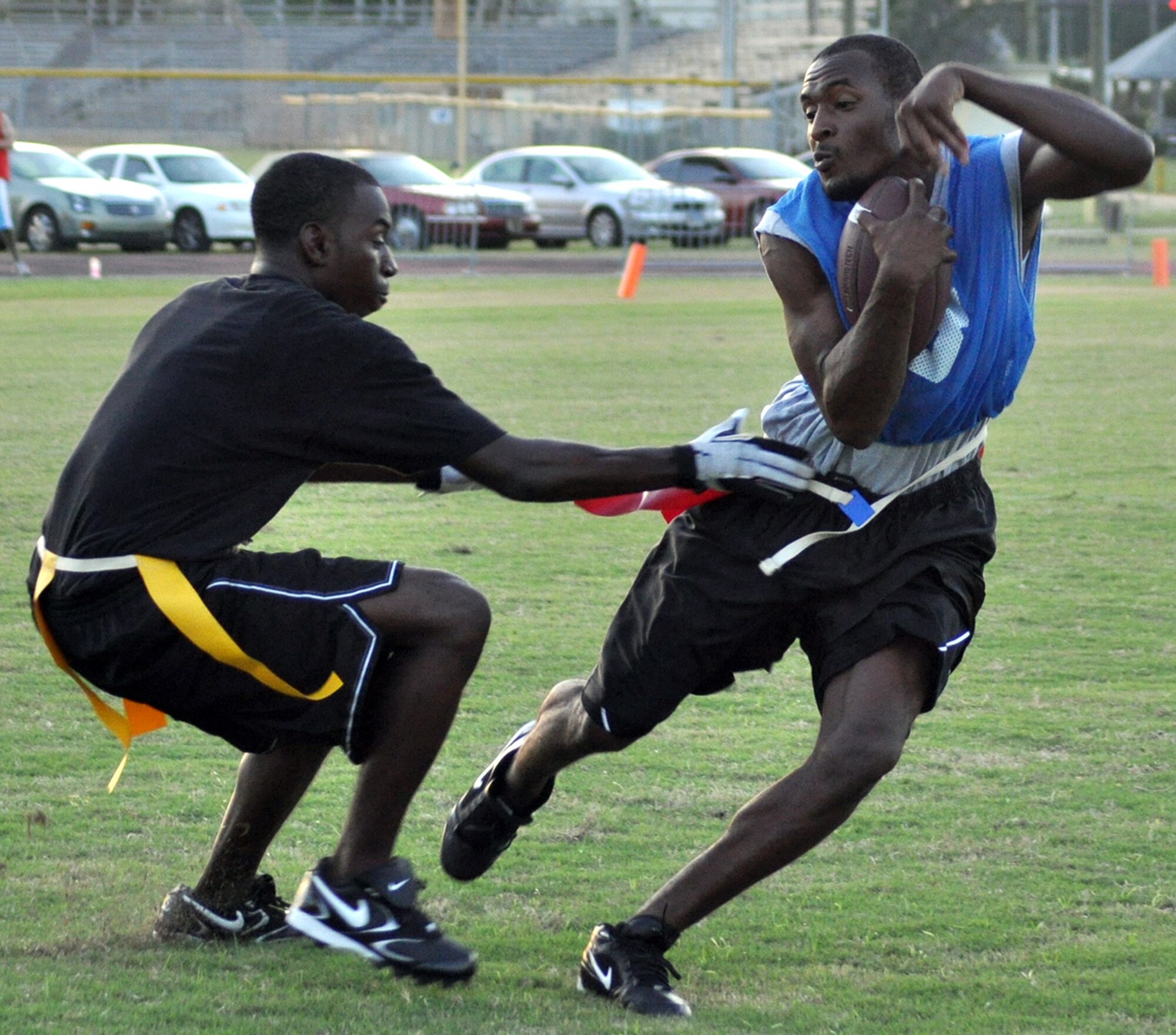 EGLIN AIR FORCE BASE, Fla. – Senior Airman Steve Cooper, 96th Logistics Readiness Squadron, pulls the flag off Julius Johnson, 96th Force Support Squadron, during a flag football preseason game Oct. 6. 96th LRS team won 13-0. Regular season begins Oct. 12. (U.S. Air Force photo/ Airman Anthony Jennings)