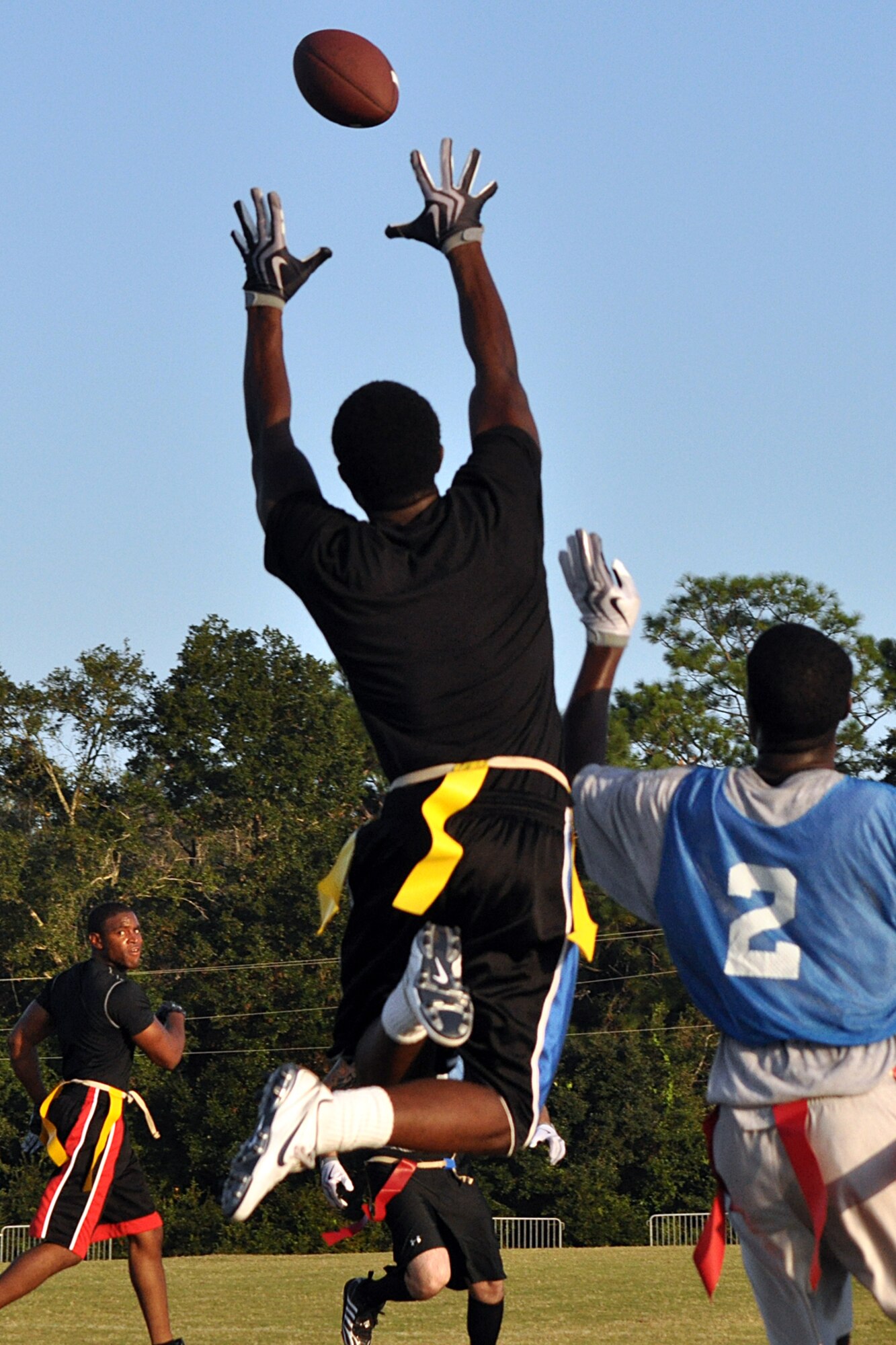 EGLIN AIR FORCE BASE, Fla. – Senior Airman David Hendricks, 96th Logistics Readiness Squadron jumps for the interception during a flag football preseason game Oct. 6. 96th LRS team beat the Force Support Squadron team 13-0. Regular season begins Oct. 12. (U.S. Air Force photo/ Airman Anthony Jennings)