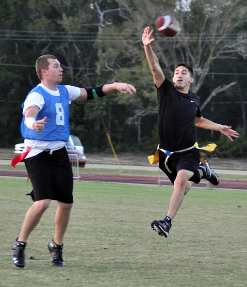 EGLIN AIR FORCE BASE, Fla. – Airman 1st Class Eric Epifanio, 96th Logistics Readiness Squadron, blocks a pass thrown by the 96th Force Support Squadron team’s quarterback, Airman 1st Class Darren Kelley, during a flag football preseason game Oct. 6. 96th LRS team won 13-0. Regular season begins Oct. 12. (U.S. Air Force photo/ Airman Anthony Jennings)