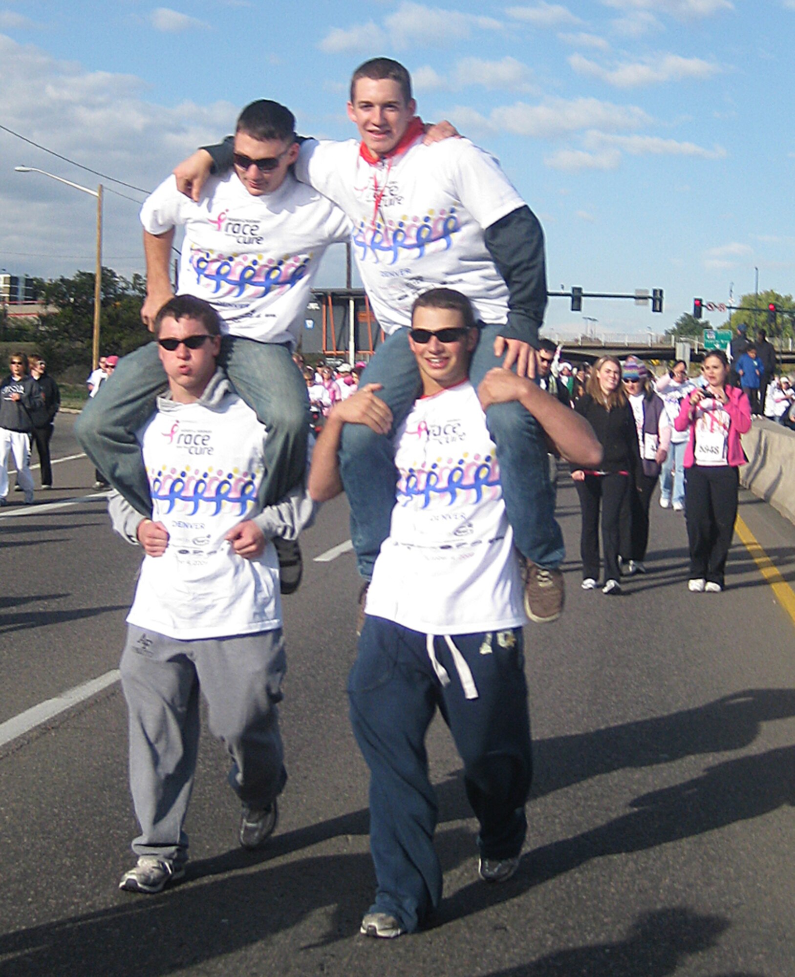 Air Force Academy gymnasts take part in the Susan B. Komen Race for the Cure in Denver Oct. 4, 2009. The men's and women's gymnastics teams joined more than 57,000 other participants and raised $2,150 toward breast cancer research. (U.S. Air Force photo courtesy of Athletic Communications)