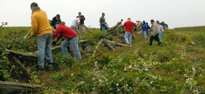 More than 50 Team Dover volunteers helped to restore fence lines, stone walls and clear away overgrowth at the Gettysburg National Military Park in Pennsylvania Oct. 2. (U.S. Air Force photo/ Airman 1st Class Shen-Chia Chu)