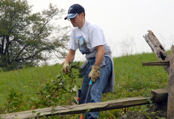 Senior Airman James Allen, 436th Force Support Squadron, clears away leaves at the Gettysburg National Military Park Oct. 2. More than 50 Team Dover volunteers made the three hour journey to Pennsylvania to help clean up the military park. (U.S. Air Force photo/ Airman 1st Class Shen-Chia Chu)